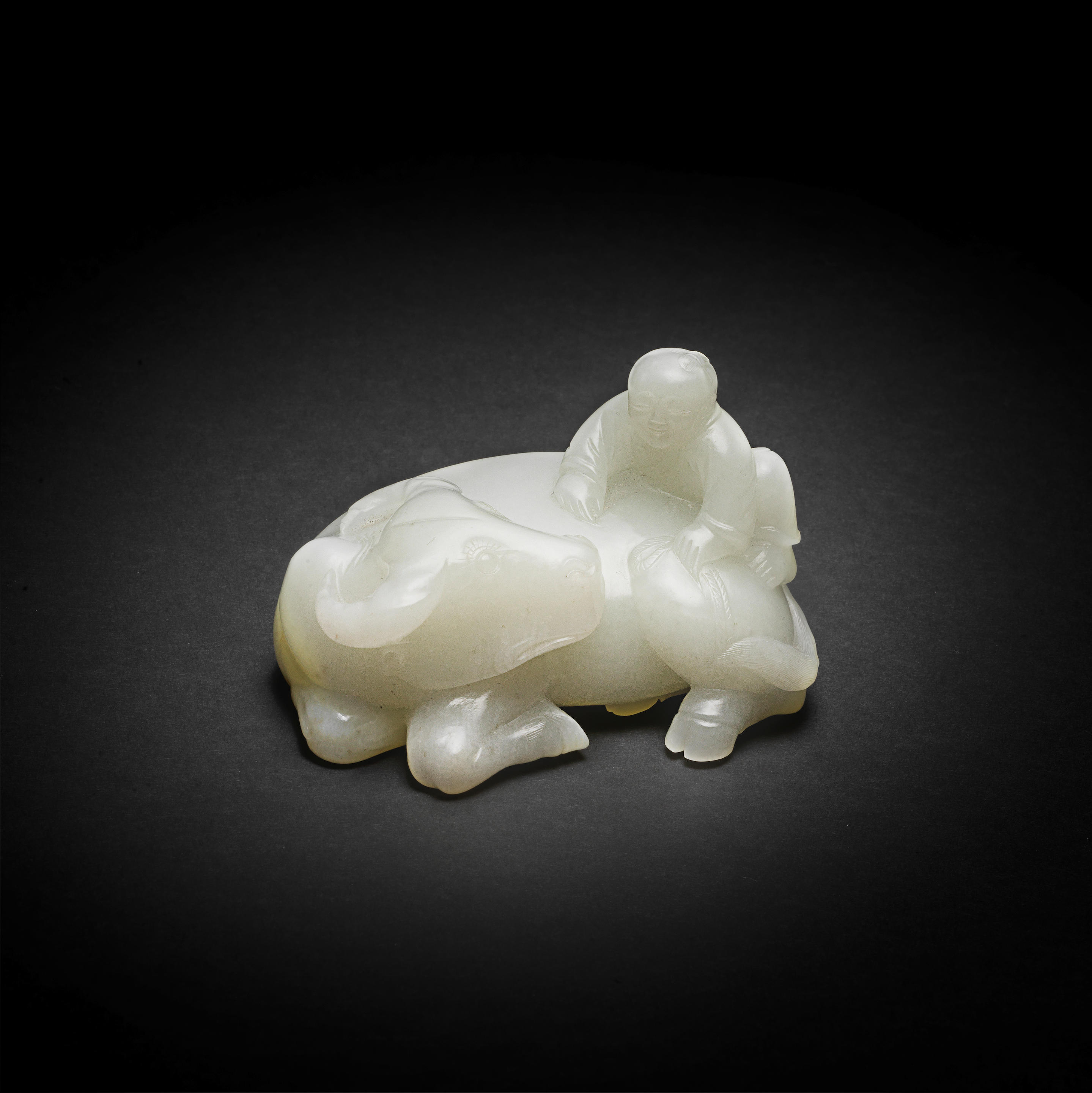 Appraisal: A FINE WHITE JADE 'WATER BUFFALO AND BOY' GROUP Qianlong