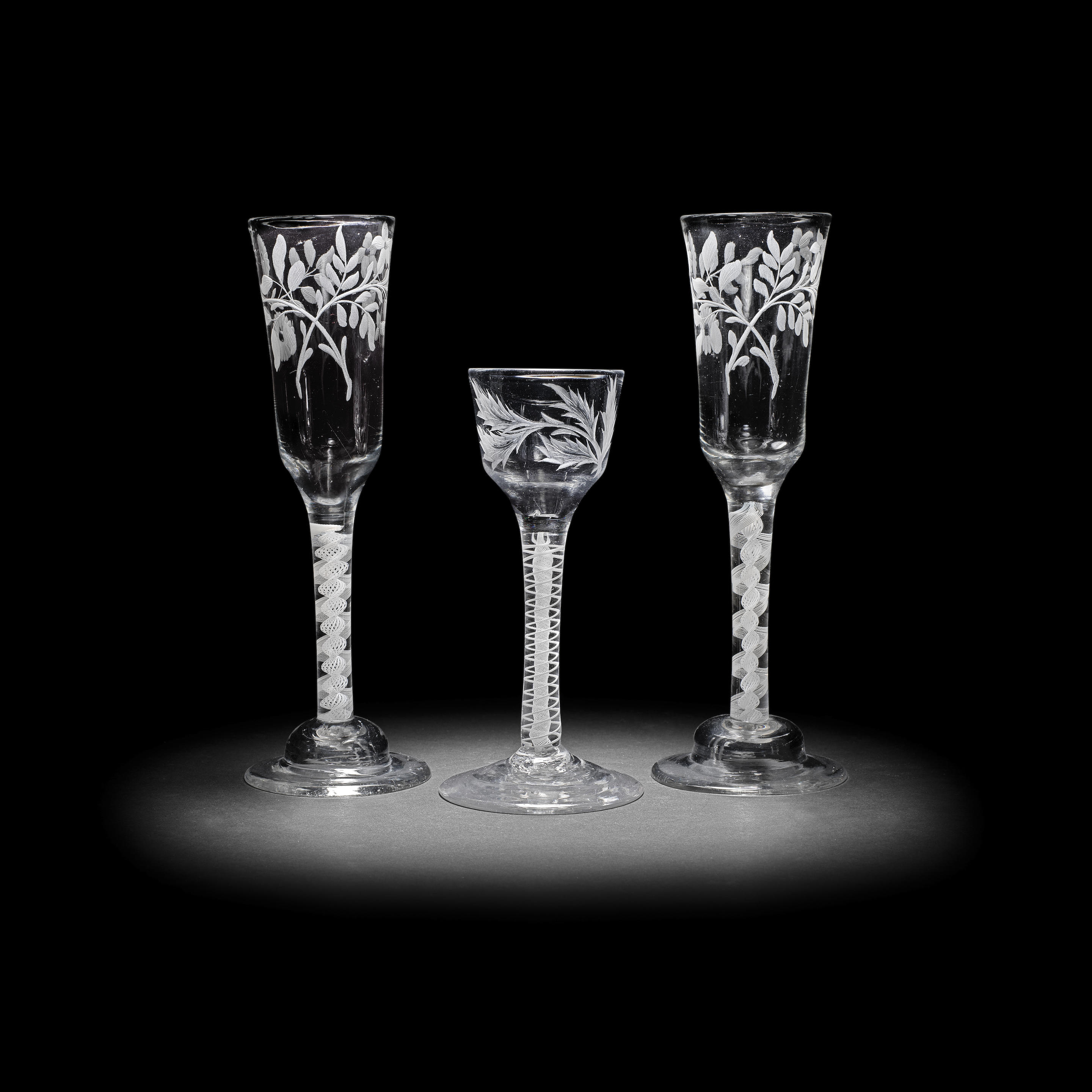 Appraisal: A PAIR OF ENGRAVED OPAQUE TWIST ALE FLUTES AND A