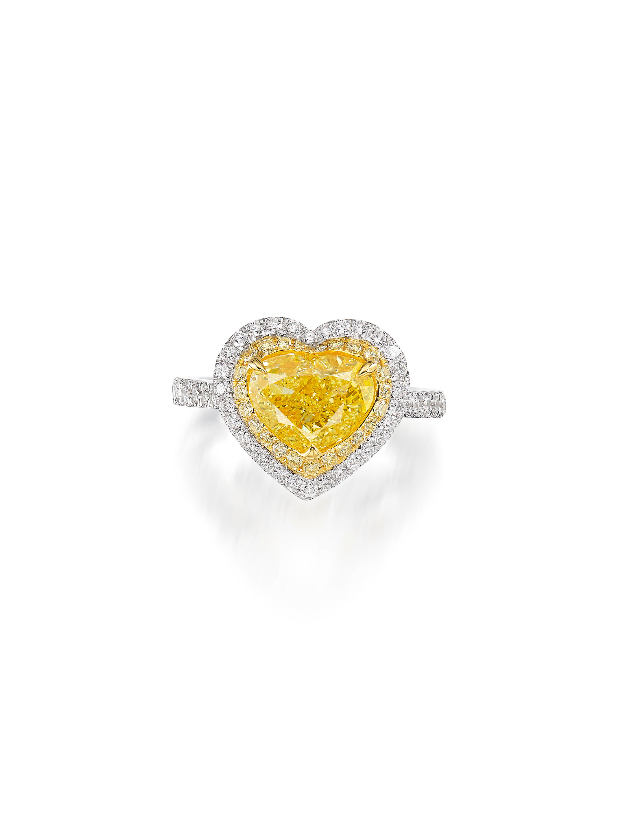 Appraisal: A COLOURED DIAMOND AND DIAMOND RING Set with a heart-shaped