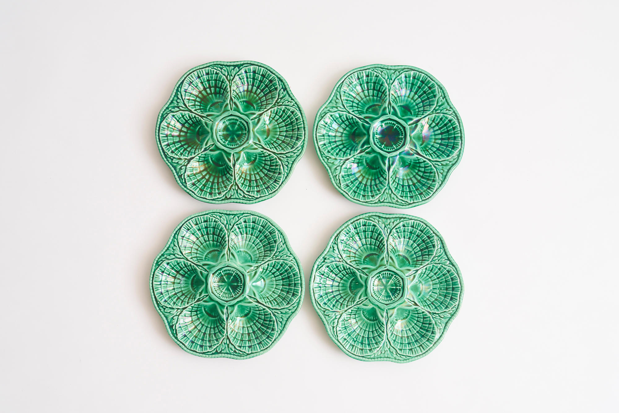 Appraisal: SARREGUEMINES FOUR OYSTER PLATES CIRCA in green majolica signed to