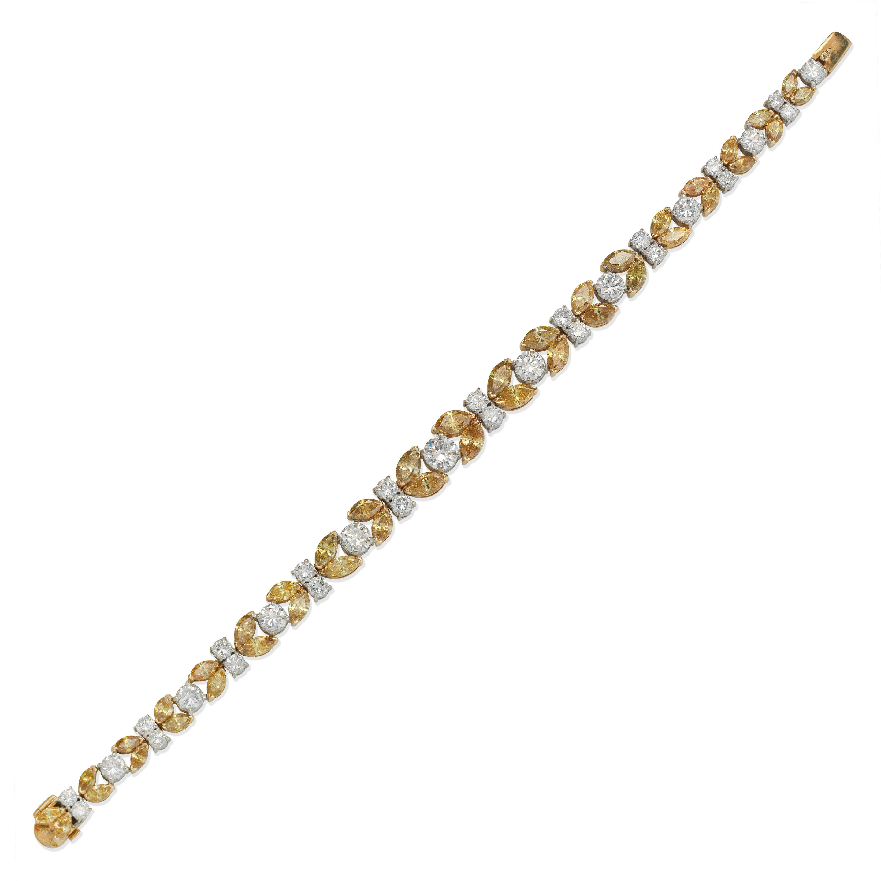 Appraisal: DIAMOND AND COLOURED DIAMOND BRACELET Marquise-cut diamonds of brownish yellow