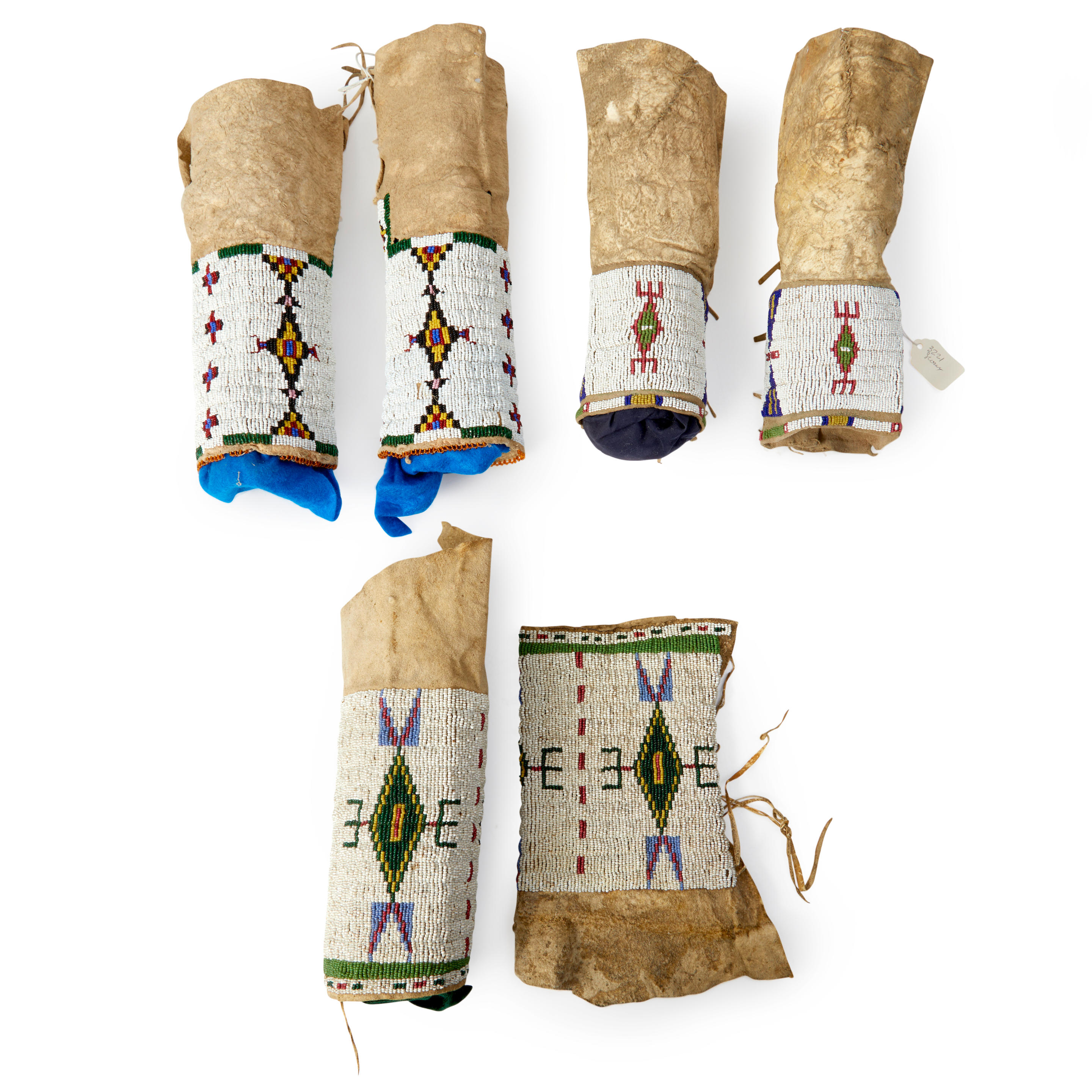 Appraisal: THREE PAIR OF PLAINS BEADED HIDE LEGGINGS Two Lakota Sioux