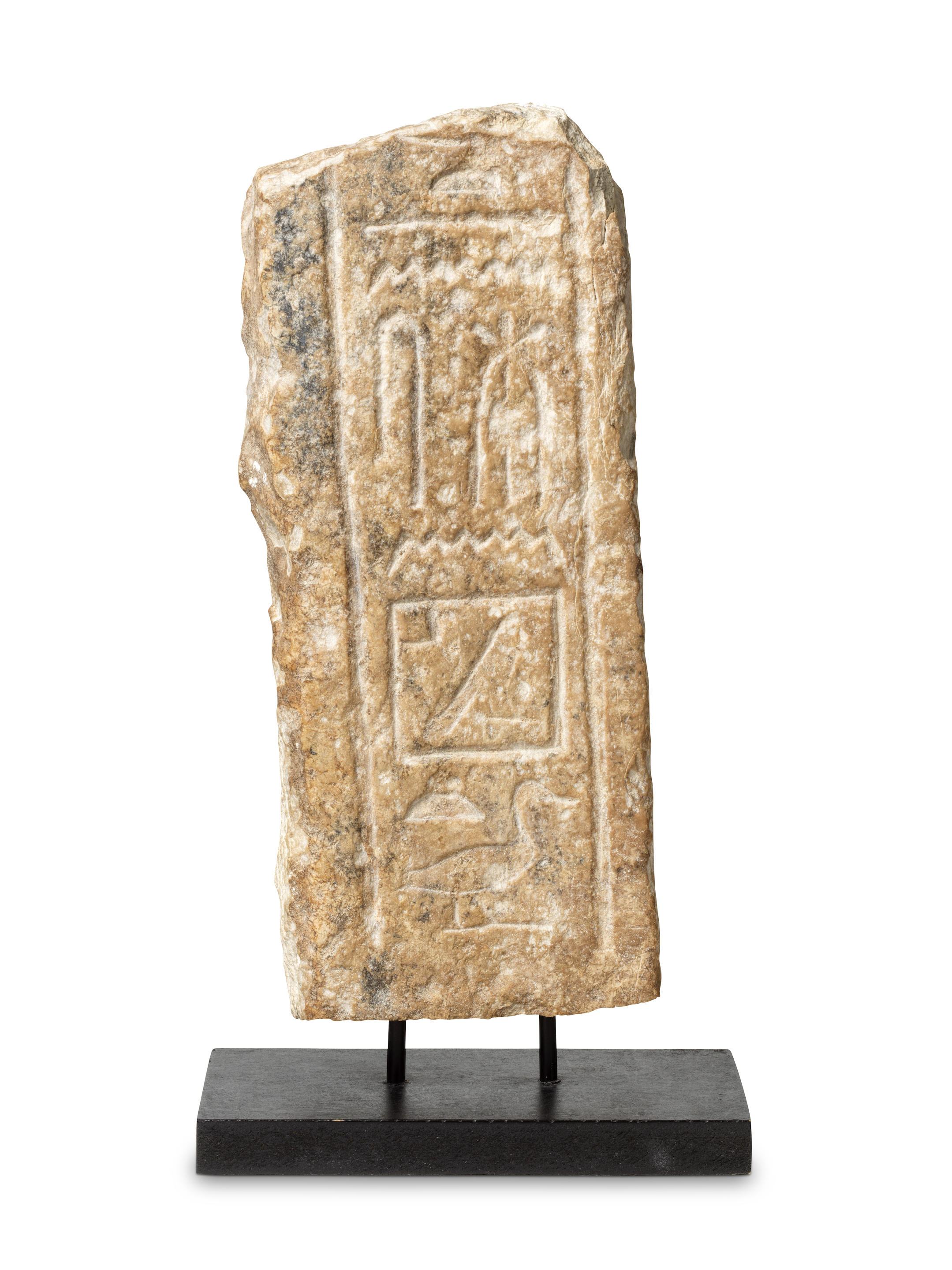 Appraisal: AN EGYPTIAN LIMESTONE RELIEF WITH HIEROGLYPHS An Egyptian limestone relief