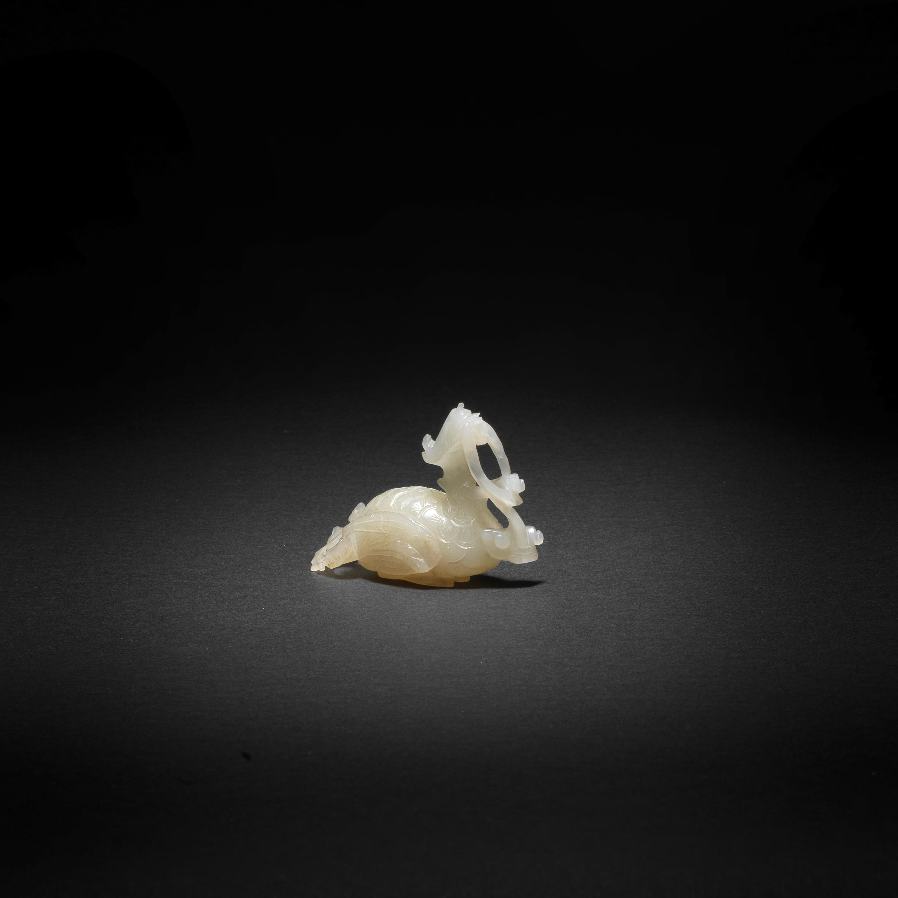 Appraisal: A RARE WHITE JADE CARVING OF A PHOENIX th century