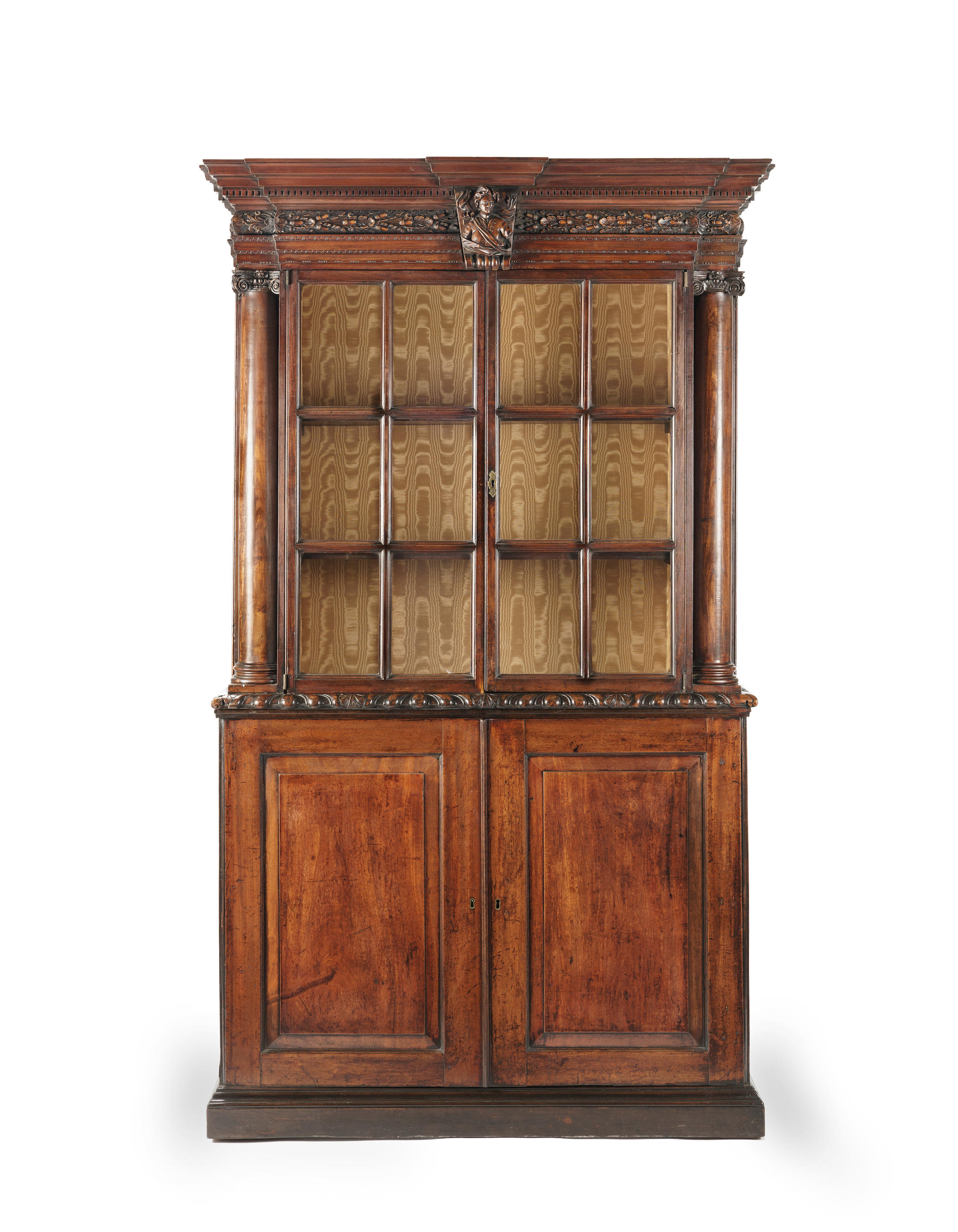 Appraisal: A MAHOGANY BOOKCASE In the manner of Giles Grendey The