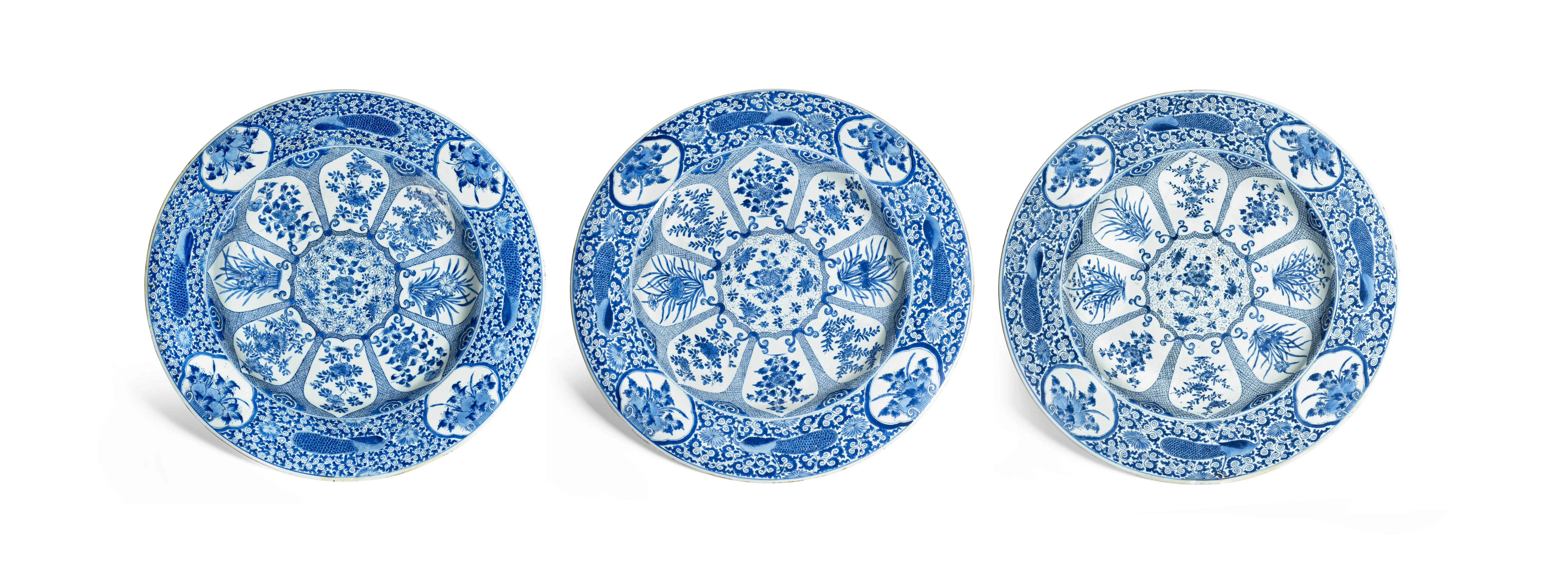 Appraisal: THREE MASSIVE BLUE AND WHITE 'PEACOCK' CHARGERS Kangxi period circa