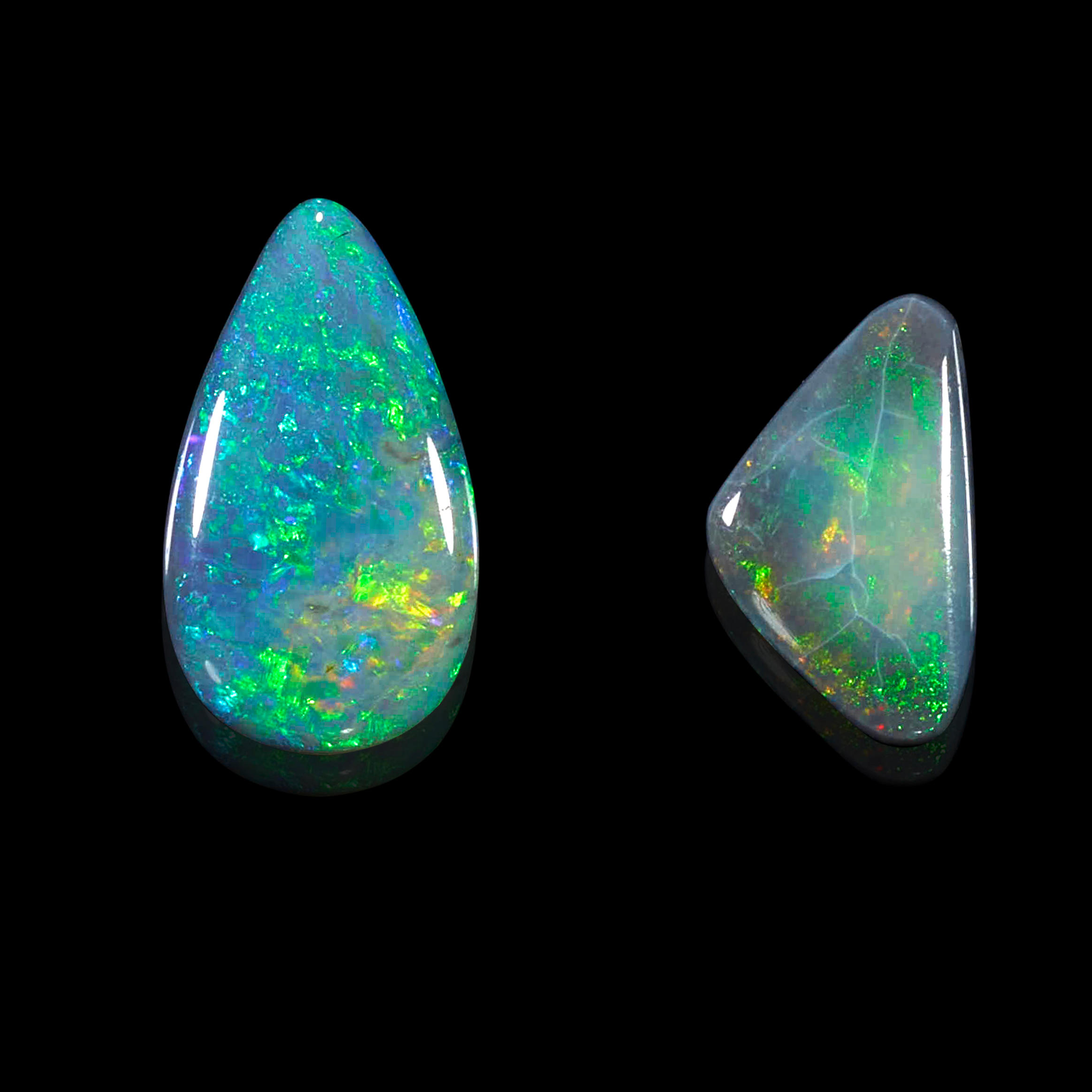 Appraisal: TWO BLACK OPALS Australia A triangular opal cabochon with a