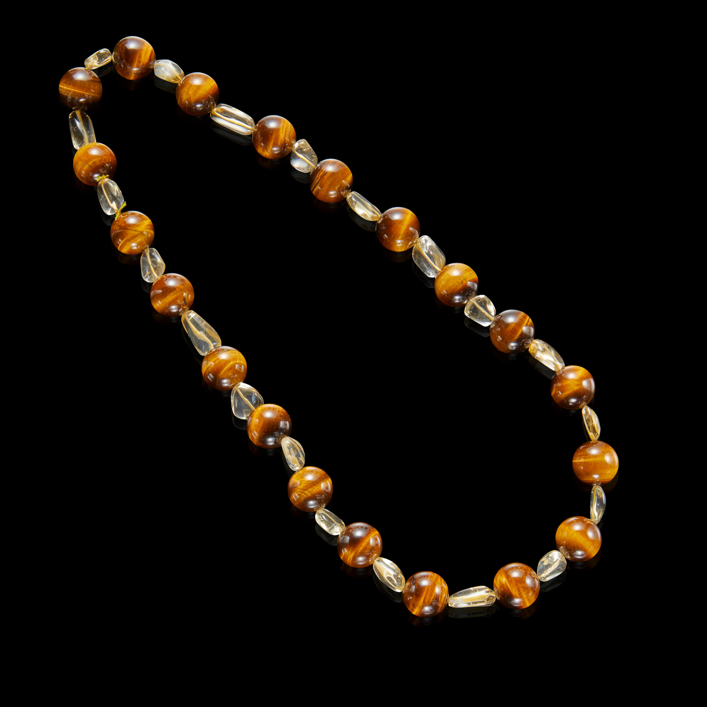 Appraisal: TIGER'S EYE QUARTZ AND CITRINE NECKLACE Designed as a single