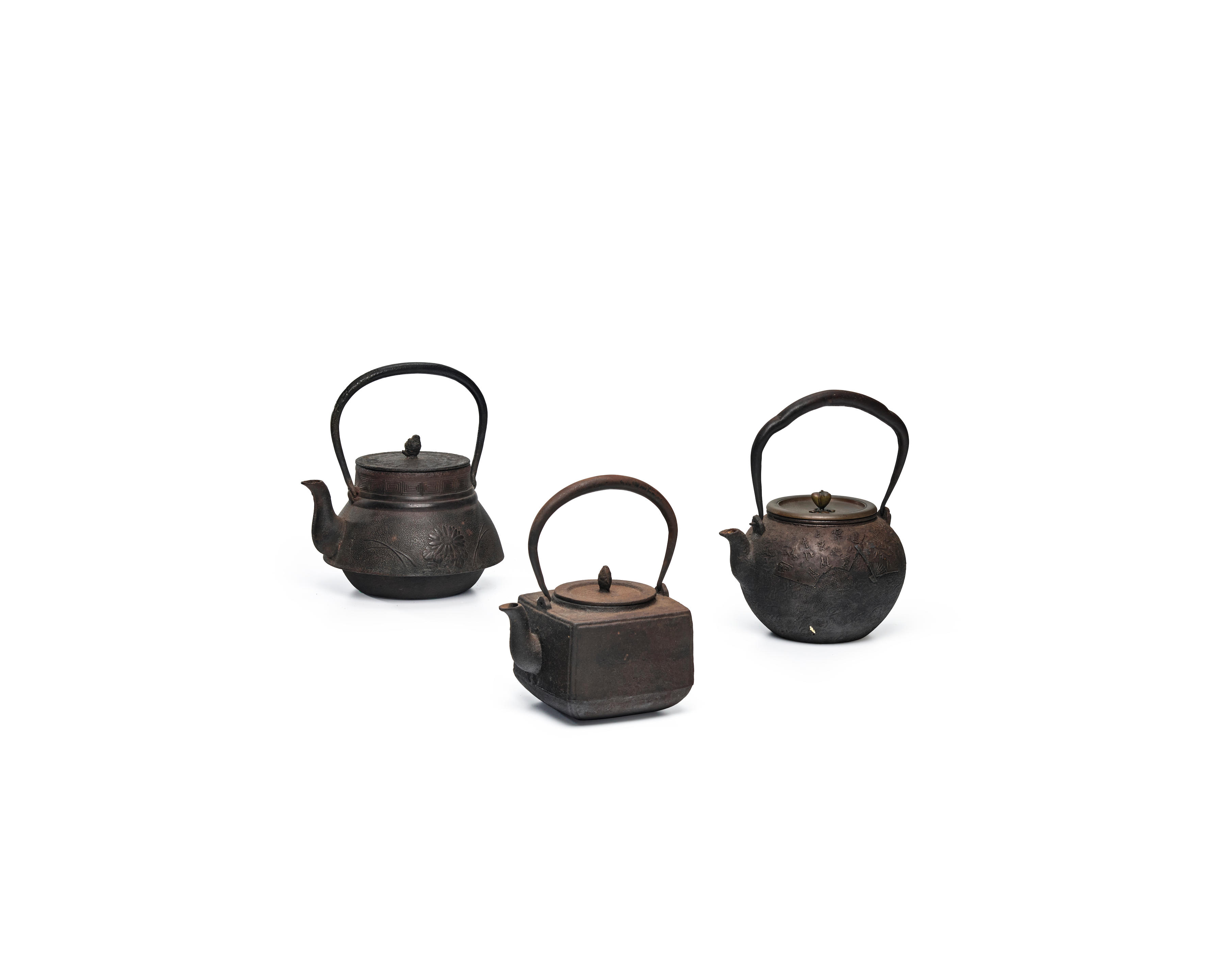 Appraisal: A GROUP OF THREE IRON TETSUBIN TEA KETTLES Meiji era