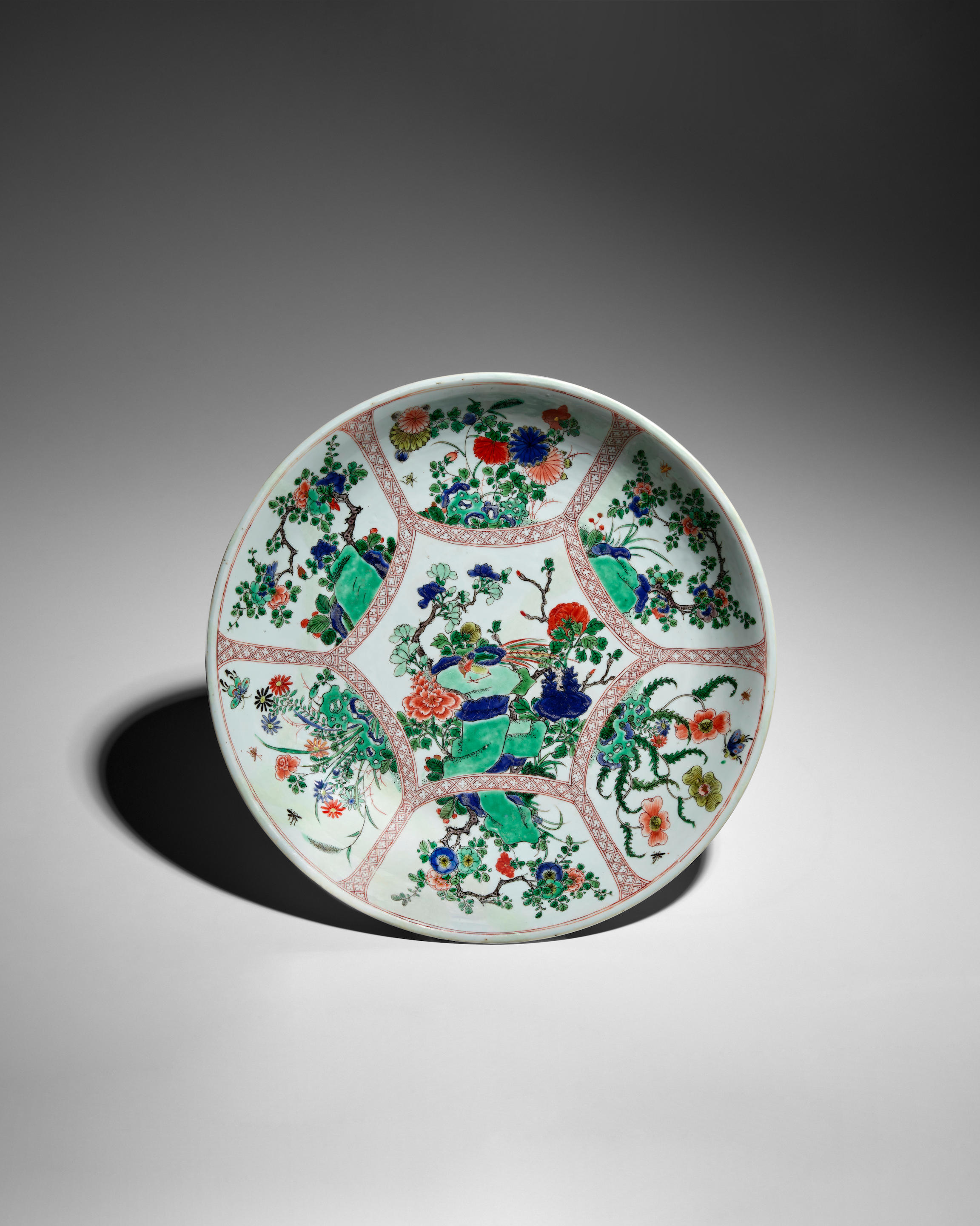 Appraisal: A FAMILLE-VERTE 'BIRD AND FLOWER' DISH Kangxi The hexagonal center