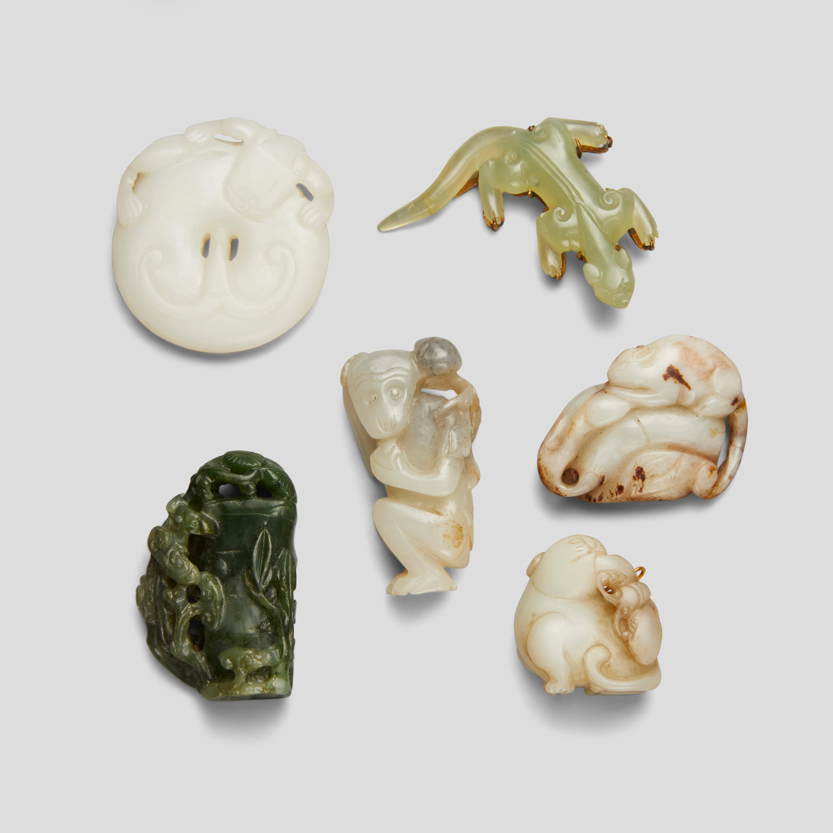 Appraisal: A GROUP OF SIX SMALL JADE AND HARDSTONE CARVINGS th