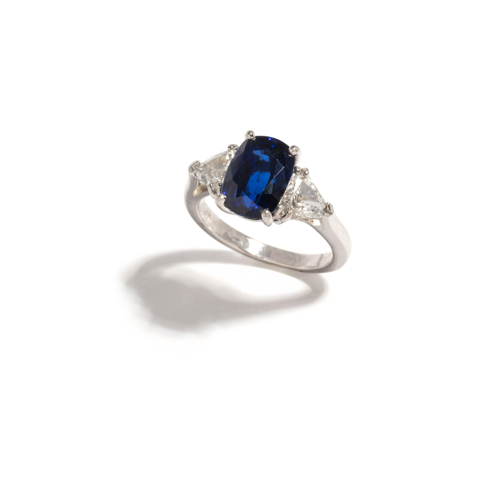 Appraisal: SAPPHIRE AND DIAMOND RING Cushion mixed cut sapphire measuring approximately