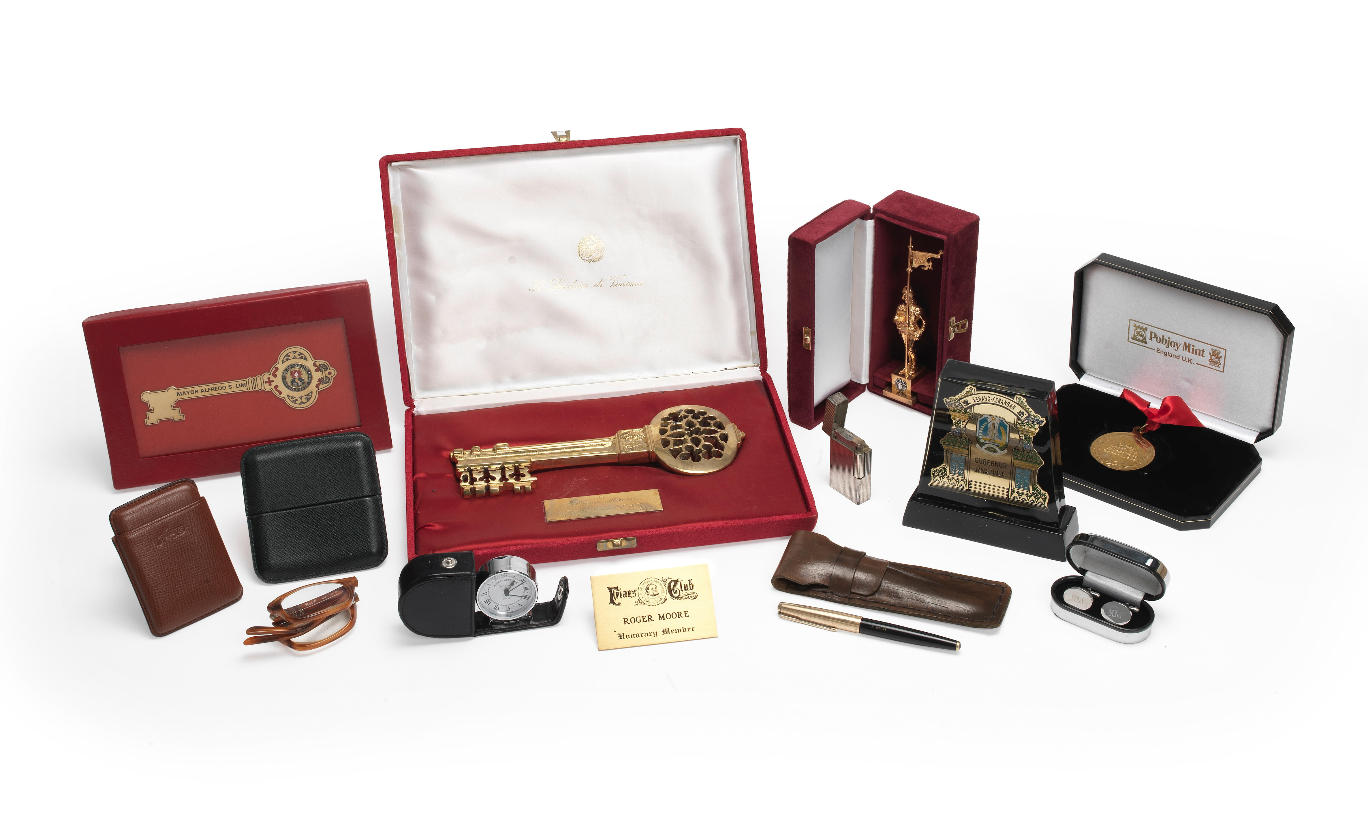 Appraisal: A COLLECTION OF SIR ROGER MOORE'S DESKTOP ACCESSORIES Comprising a