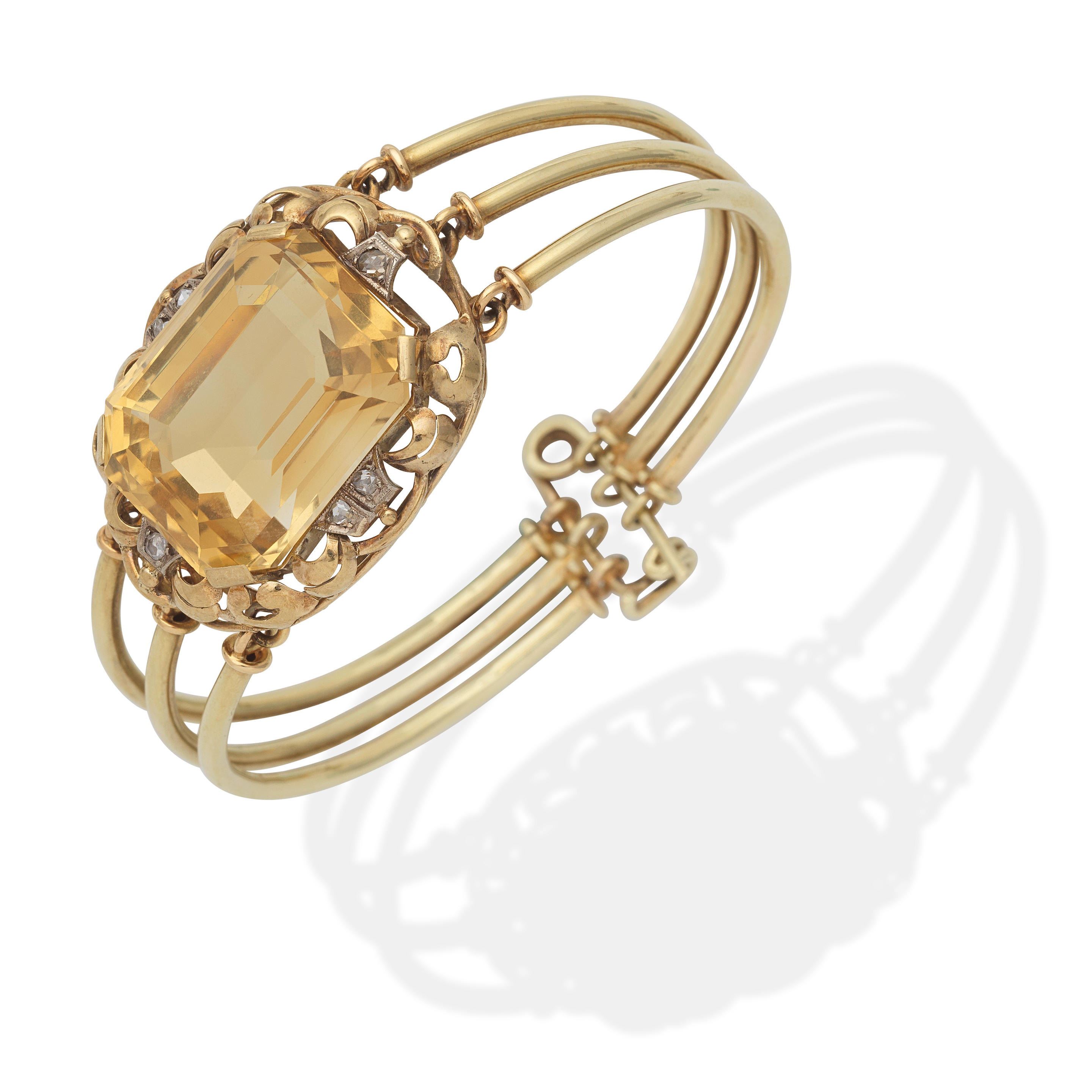 Appraisal: CITRINE BANGLE The step-cut citrine with rose-cut diamonds inner circumference