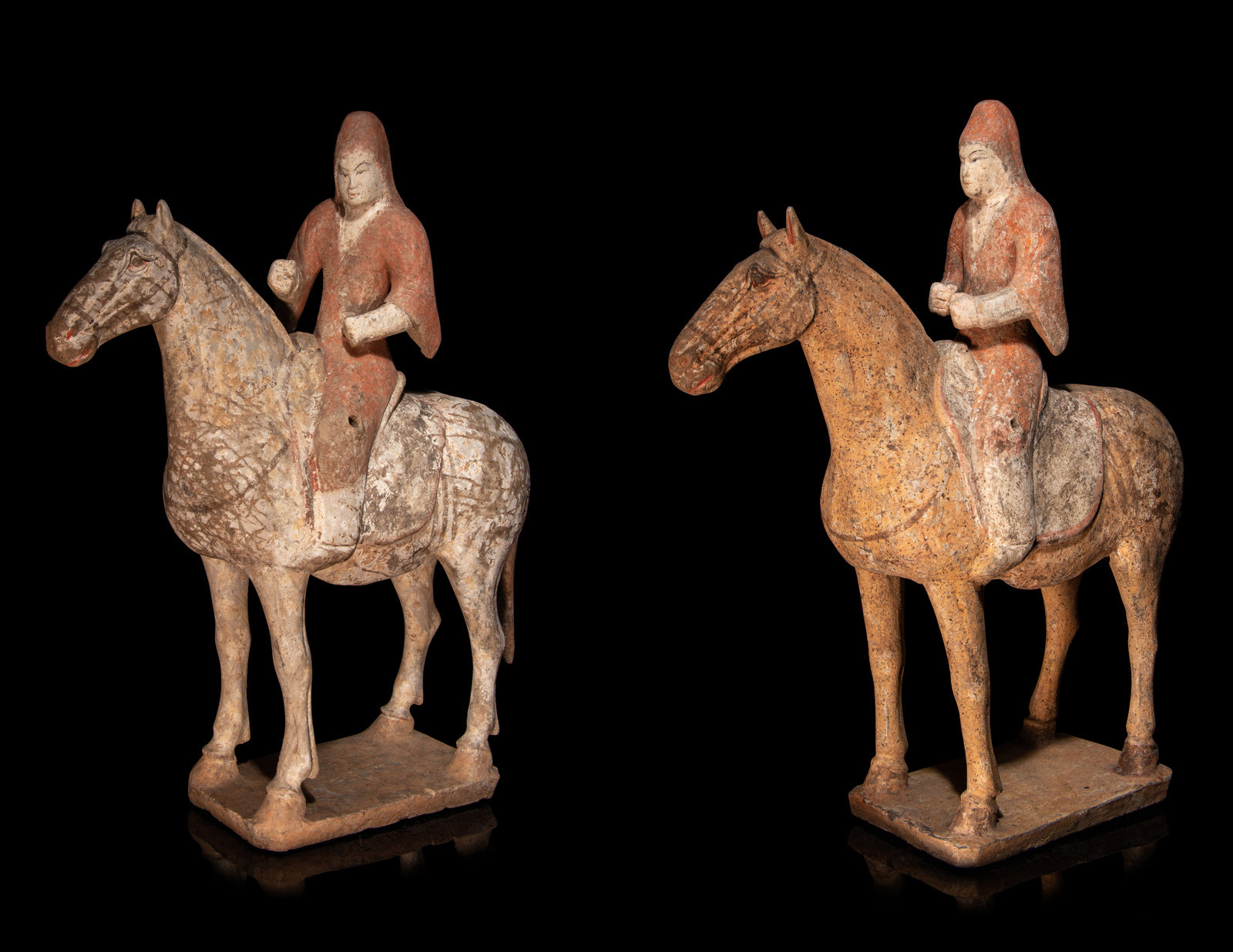 Appraisal: A Pair of Painted Pottery Equestrian Figures SUI TANG DYNASTY