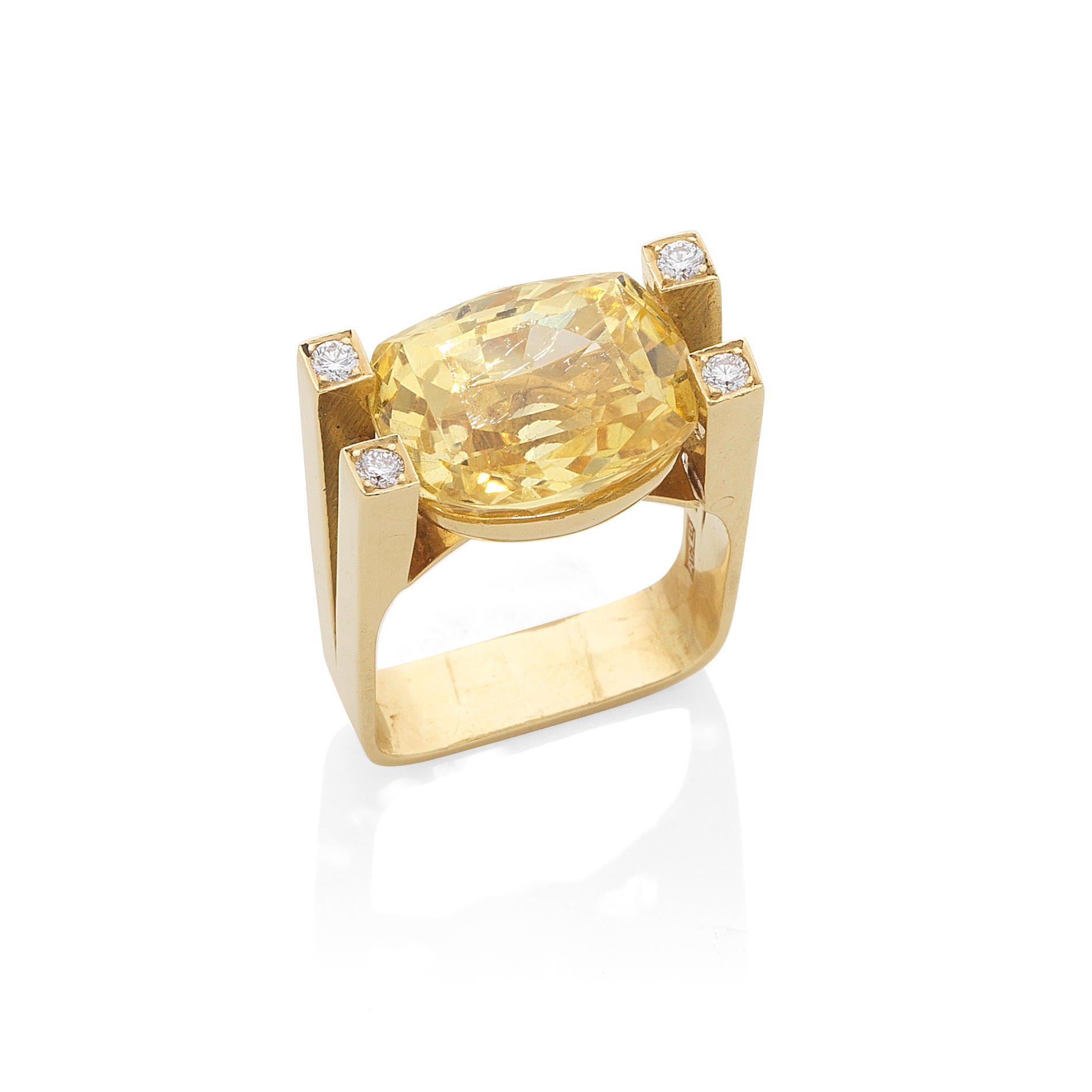 Appraisal: GRIMA YELLOW SAPPHIRE AND DIAMOND DRESS RING The cushion-shaped yellow