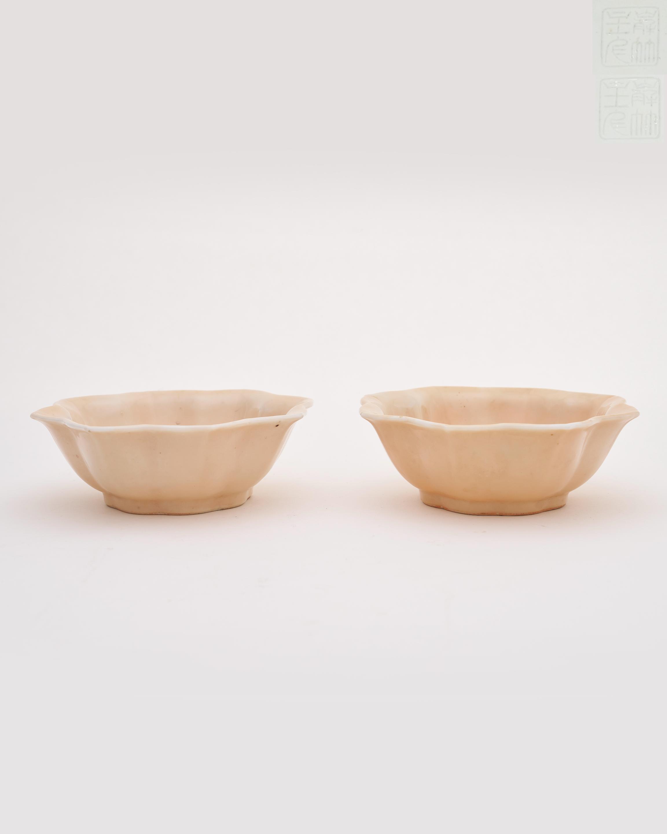 Appraisal: A PAIR OF PALE YELLOW-GLAZED EIGHT LOBED BOWLS Xiezhu studio