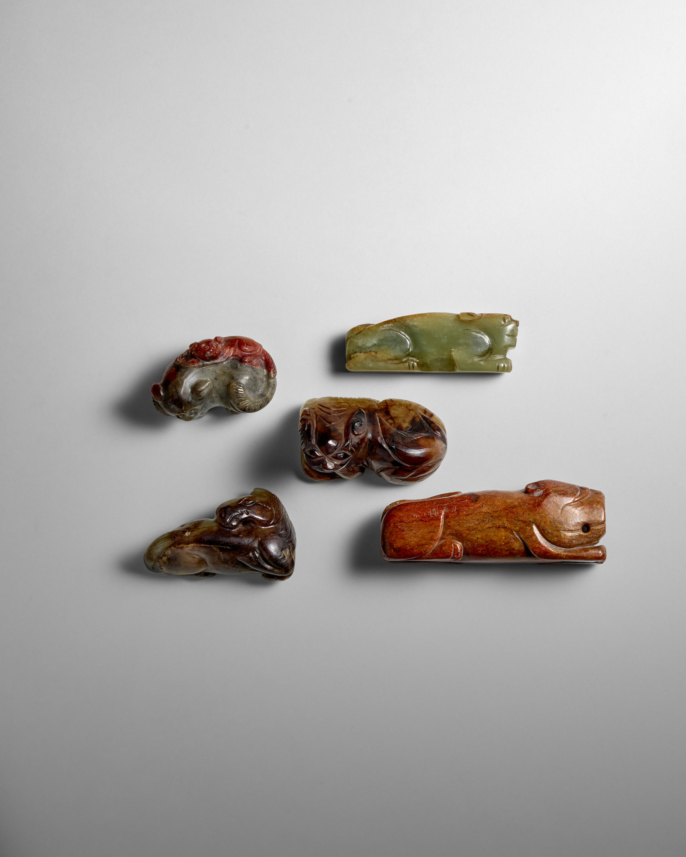 Appraisal: FIVE ARCHAISTIC JADE AND HARDSTONE ANIMAL CARVINGS Late Qing Dynasty