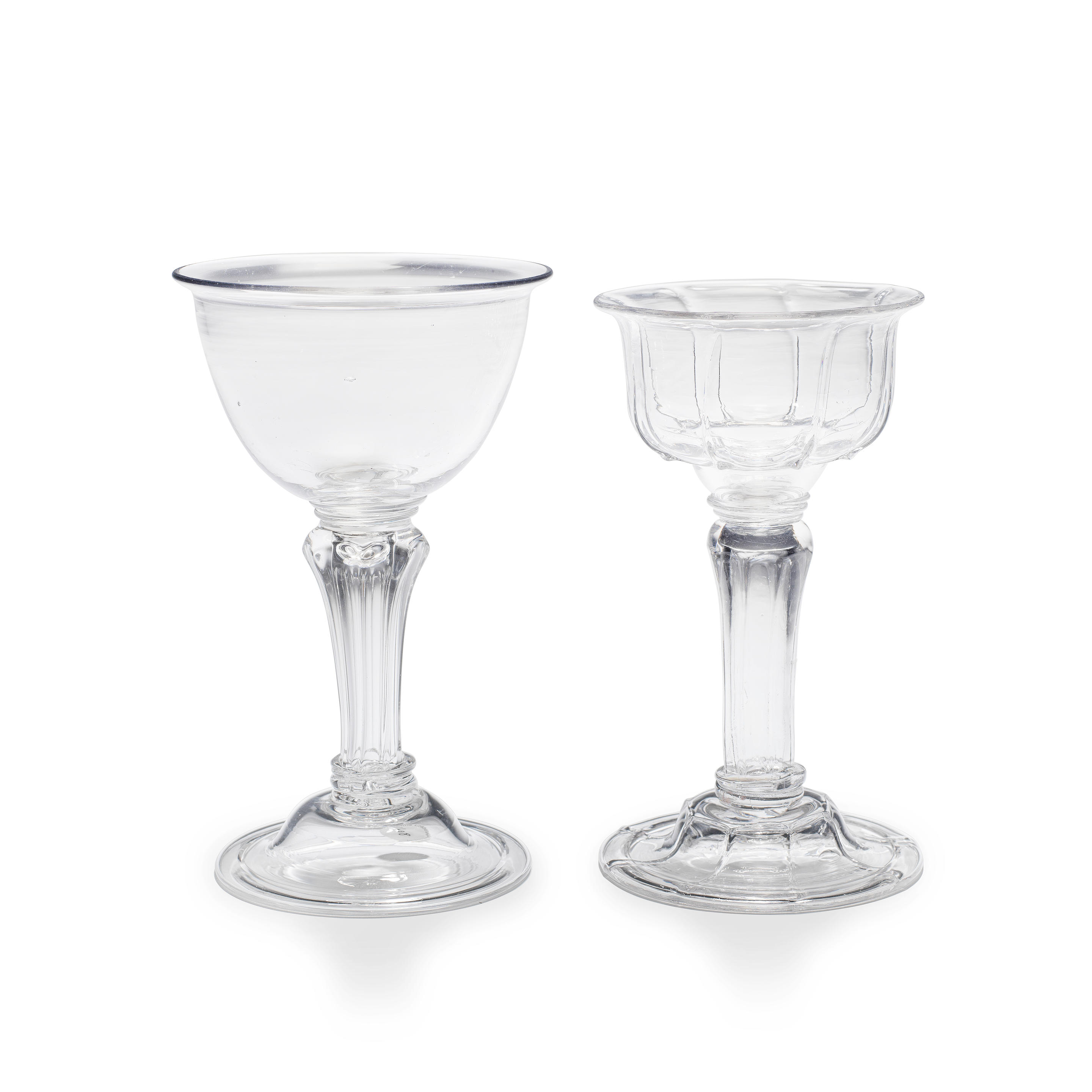 Appraisal: TWO MOULDED-STEM SWEETMEAT OR CHAMPAGNE GLASSES MID- TH CENTURY With