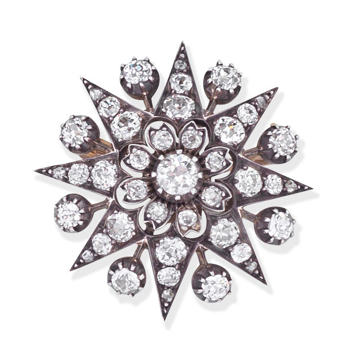 Appraisal: DIAMOND STAR PENDANT BROOCH CIRCA Of starburst design set throughout