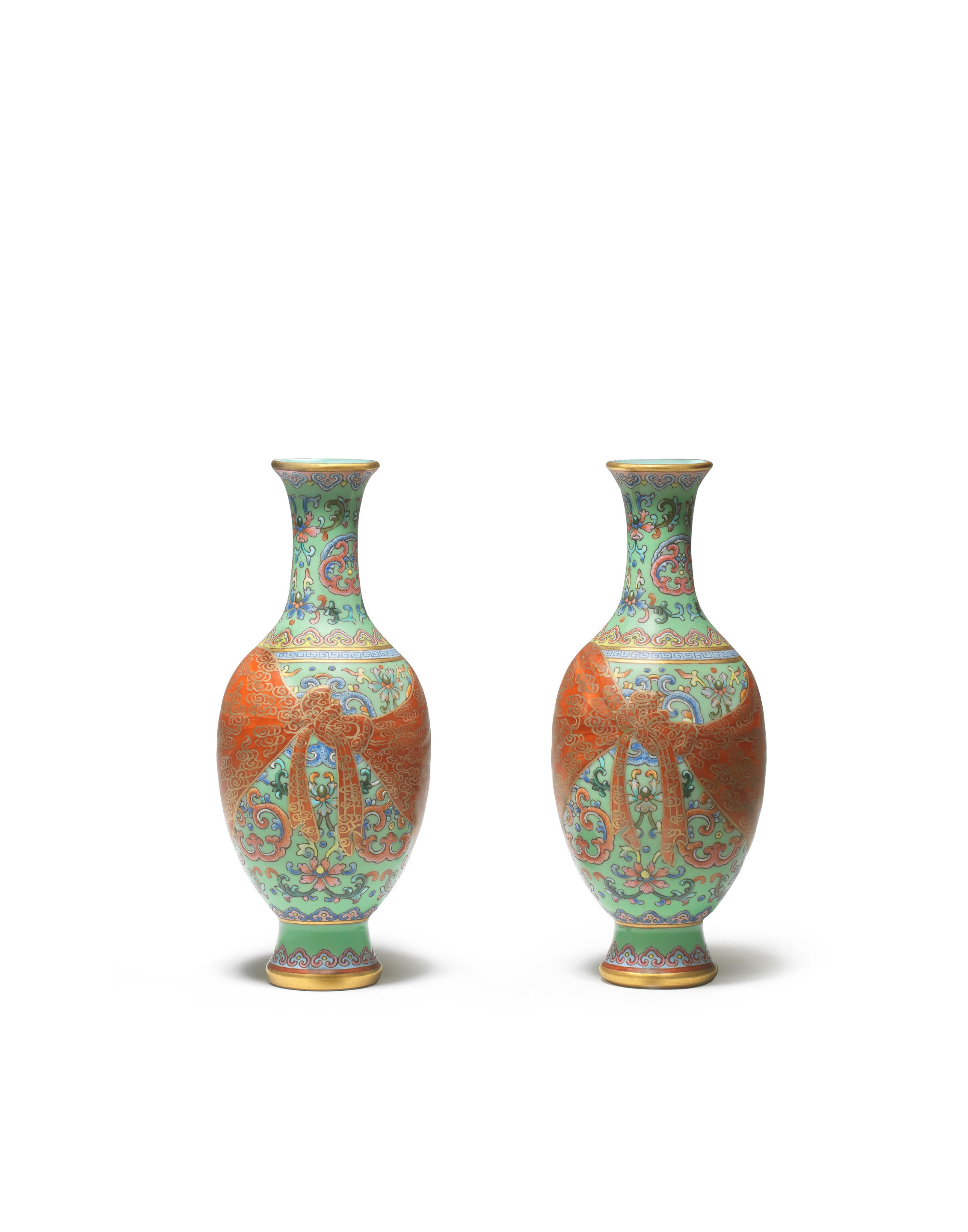 Appraisal: A RARE PAIR OF GREEN-GROUND FAMILLE-ROSE TROMPE L'OEIL VASES Qianlong