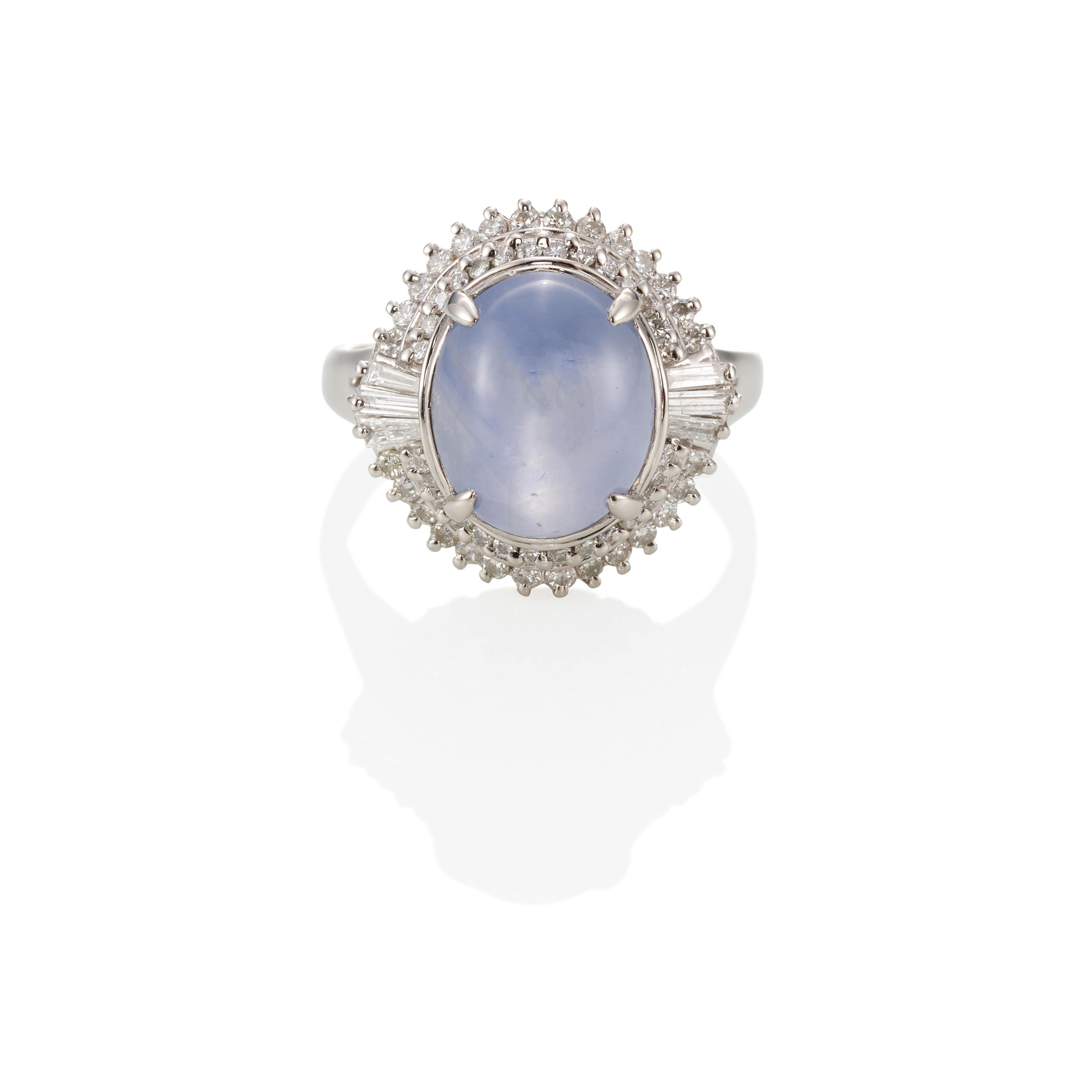 Appraisal: A PLATINUM STAR SAPPHIRE AND DIAMOND RING Star sapphire weighing