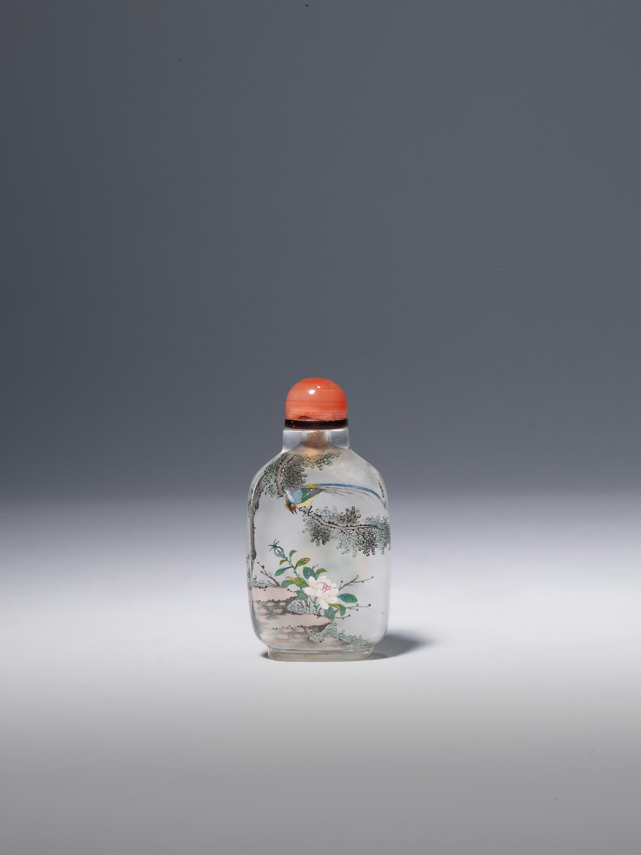 Appraisal: AN INSIDE-PAINTED ROCK CRYSTAL 'BIRD AND PEONIES' SNUFF BOTTLE Ye