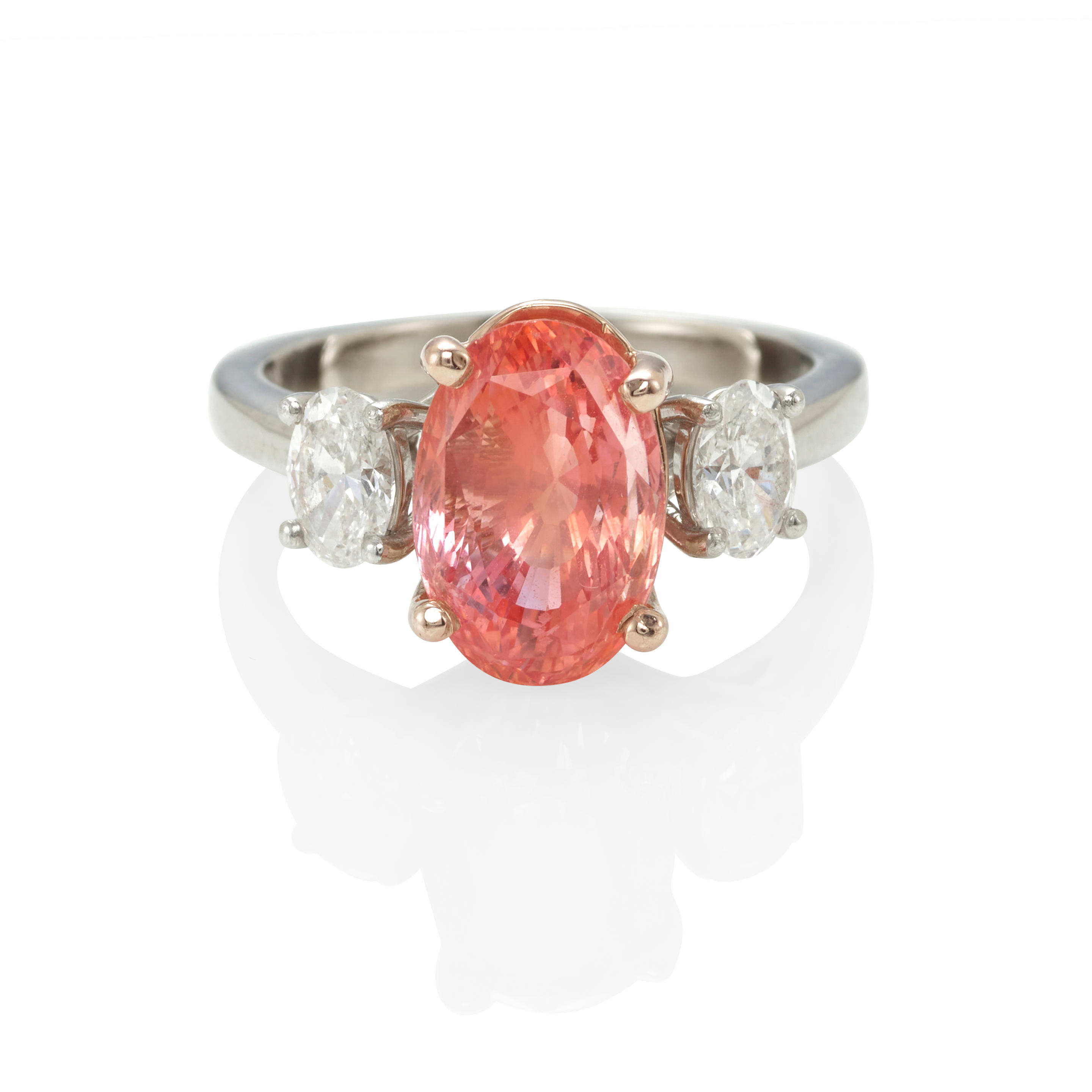 Appraisal: A PLATINUM K ROSE GOLD PADPARADSCHA SAPPHIRE AND DIAMOND RING