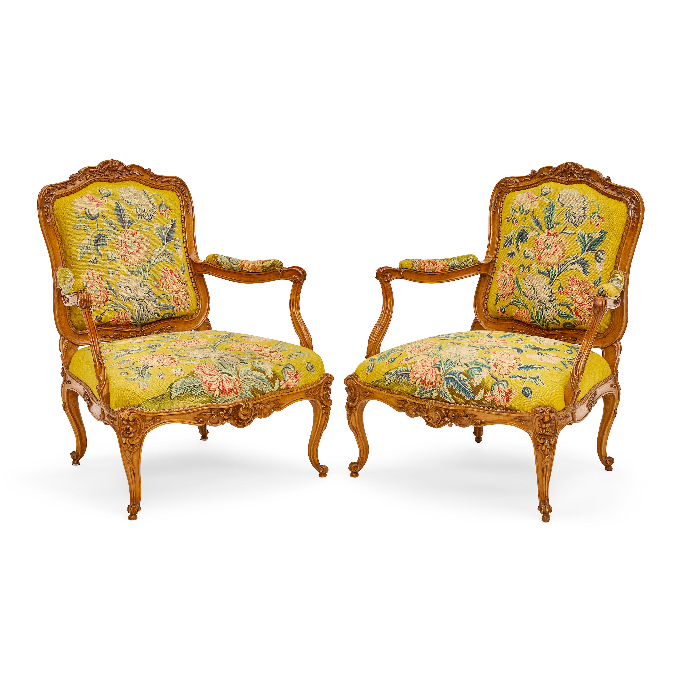 Appraisal: A PAIR OF LOUIS XV NEEDLEPOINT UPHOLSTERED BEECHWOOD FAUTEUILS Early