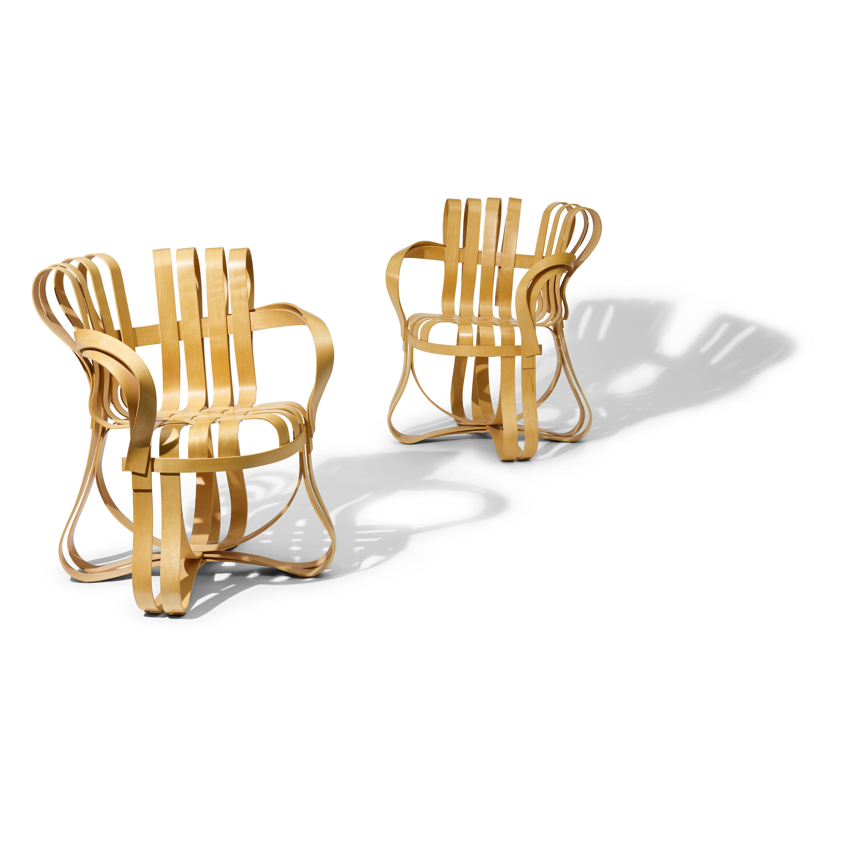 Appraisal: FRANK GEHRY BORN Pair of Cross Check Armchairs designed for