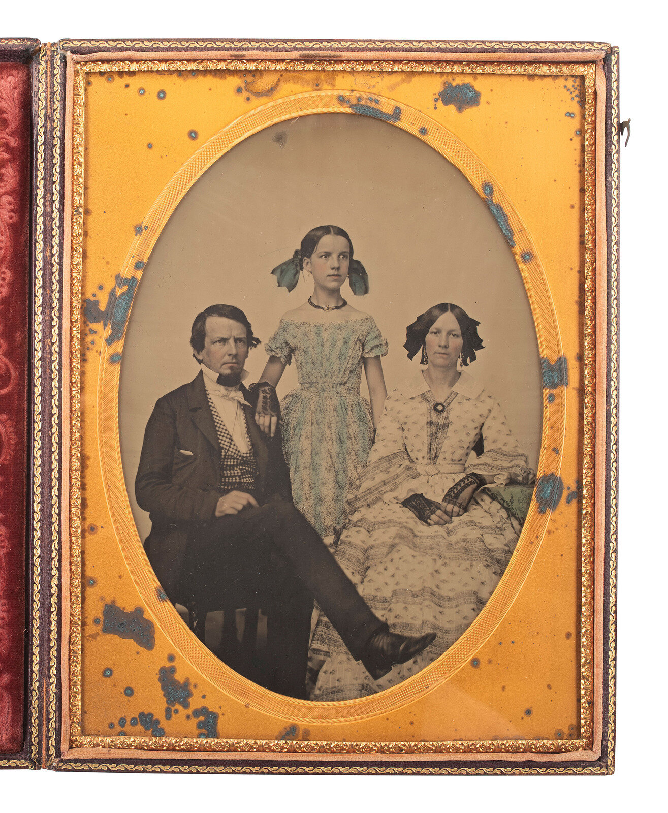 Appraisal: EARLY PHOTOGRAPHY Whole plate ambrotype of a family of three