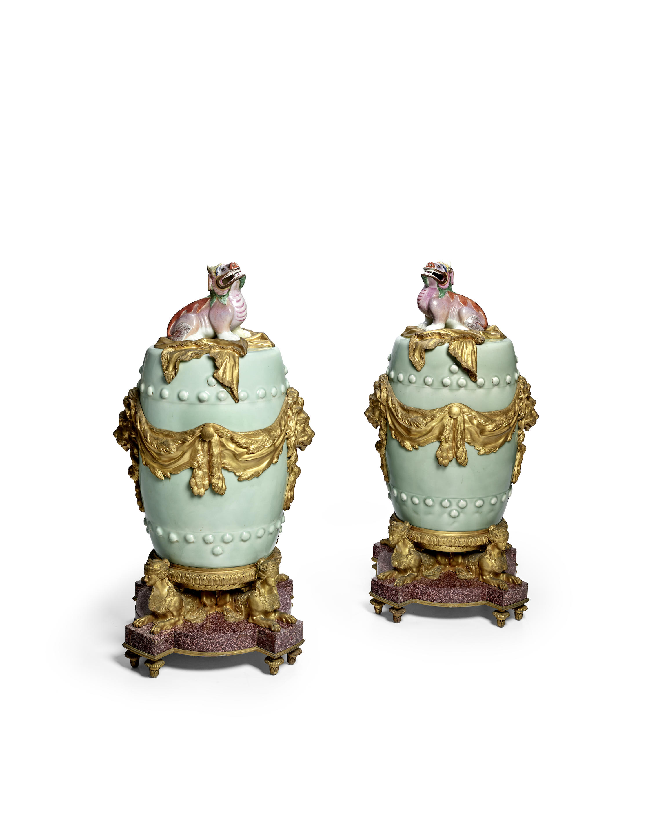 Appraisal: A PAIR OF FINE ORMOLU AND PORPHYRY-MOUNTED CELADON-GLAZED GARDEN SEATS