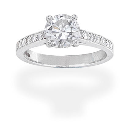 Appraisal: DIAMOND SINGLE-STONE RING The brilliant-cut diamond between shoulders set with