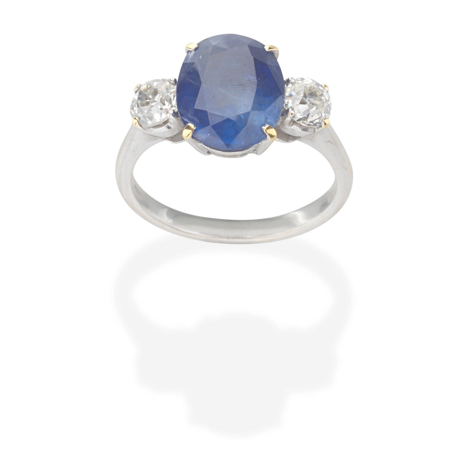 Appraisal: SAPPHIRE AND DIAMOND RING The oval-cut sapphire between old brilliant-cut