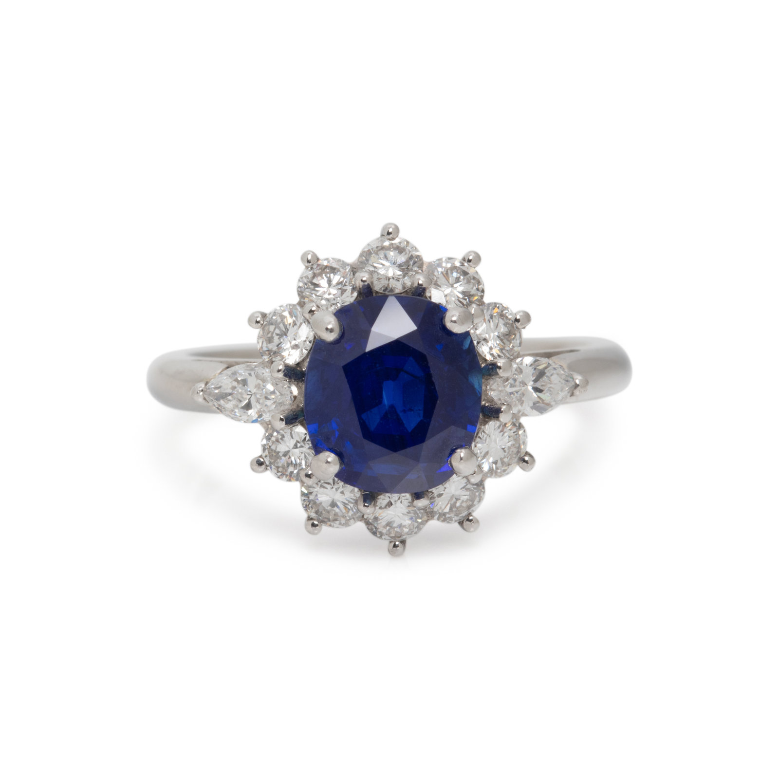 Appraisal: UNHEATED KASHMIR SAPPHIRE AND DIAMOND RING Containing one oval mixed