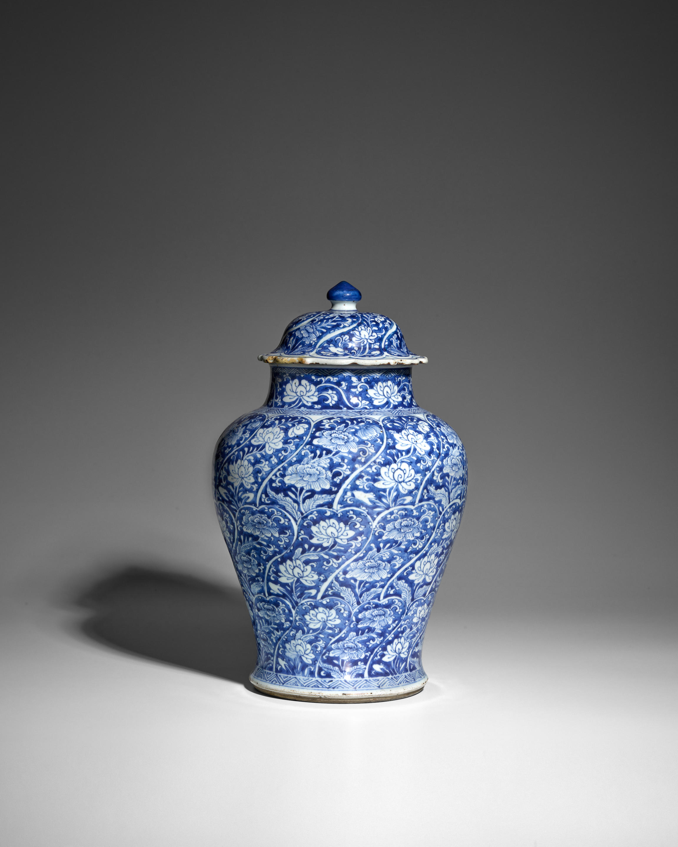 Appraisal: A BLUE AND WHITE 'PETAL'-MOLDED BALUSTER JAR AND COVER Kangxi