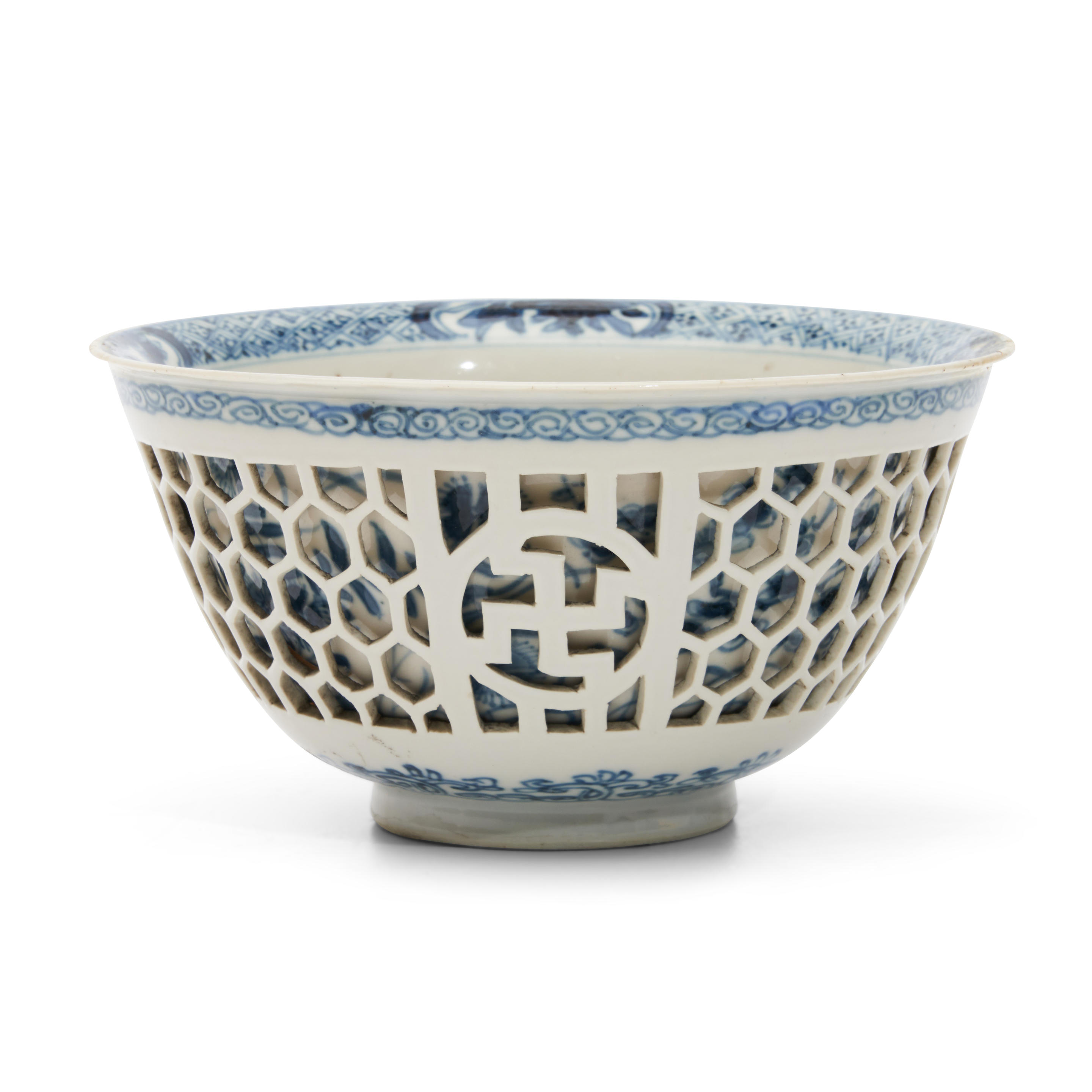 Appraisal: BLUE AND WHITE RETICULATED DOUBLE-WALLED BOWL China Kangxi period with