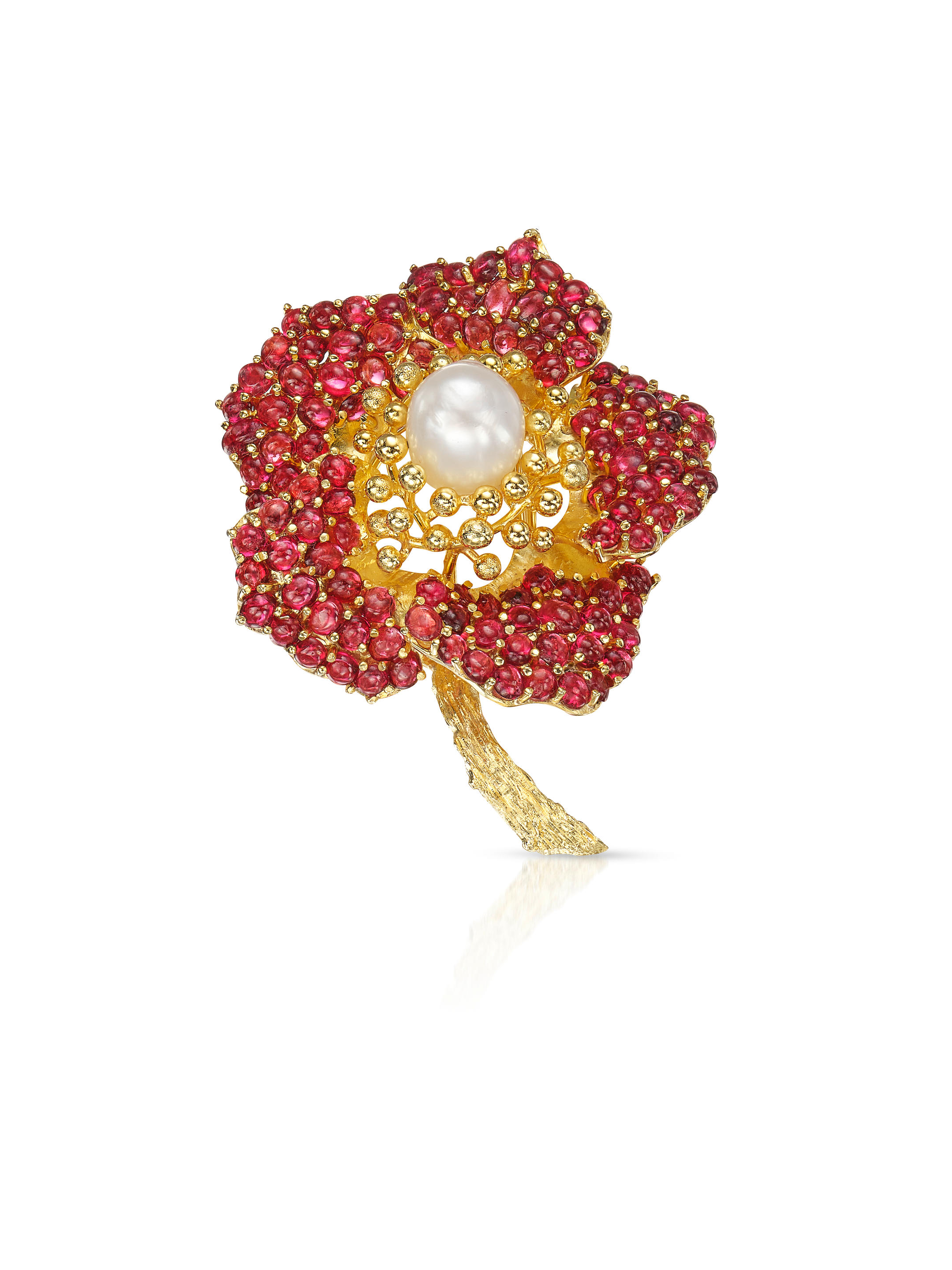 Appraisal: A CULTURED PEARL AND GARNET 'FLOWER' BROOCH Designed as a