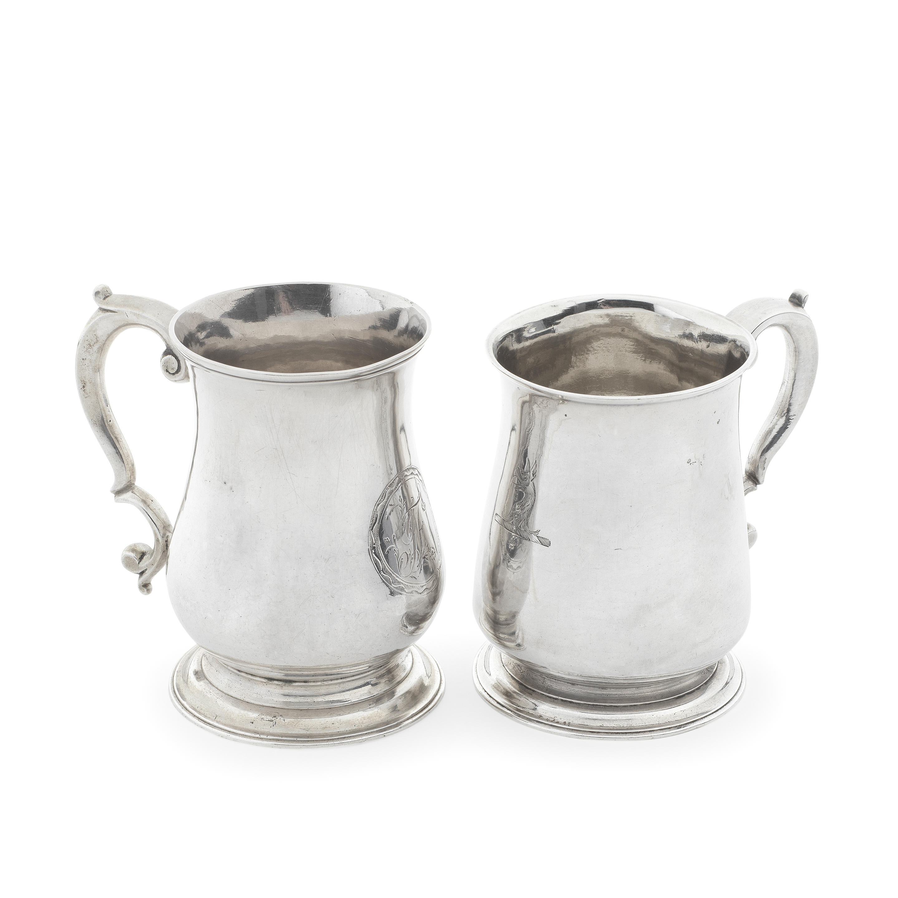 Appraisal: THREE GEORGE II SILVER MUGS various maker's and dates Comprising