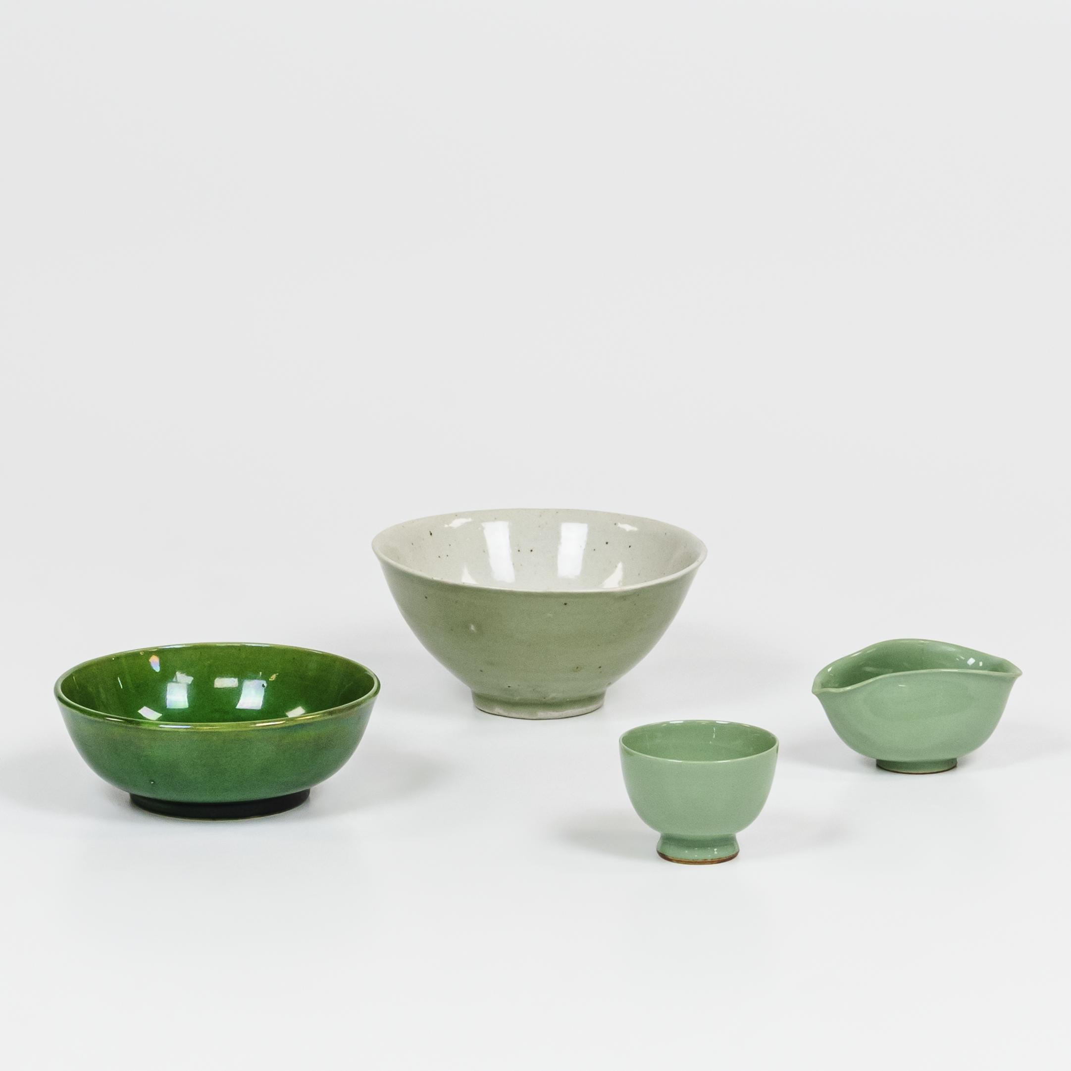 Appraisal: FOUR GLAZED CERAMIC ITEMS China a green-glazed low bowl and