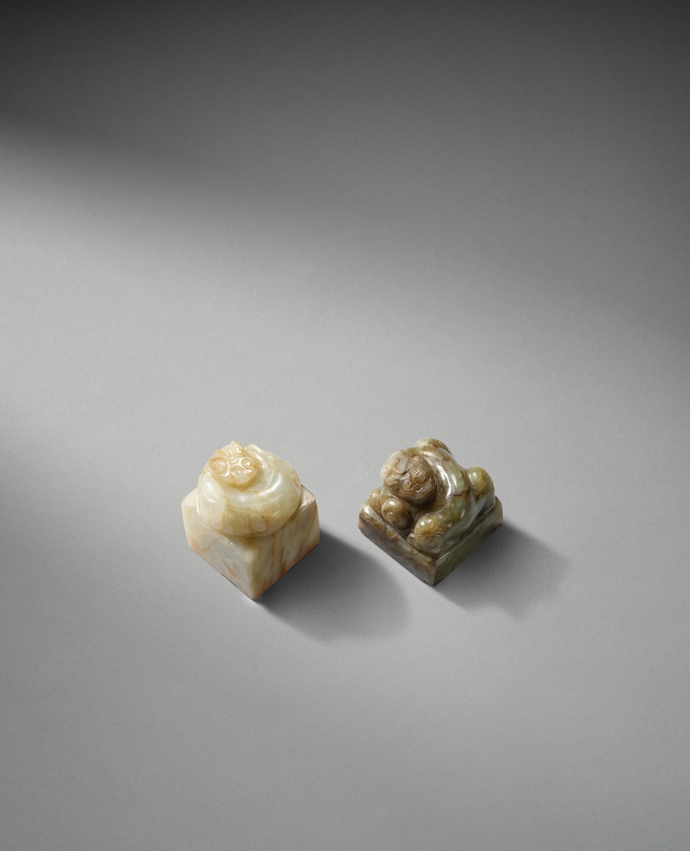 Appraisal: TWO SQUARE JADE 'CHILONG' SEALS Qing Dynasty or earlier Each