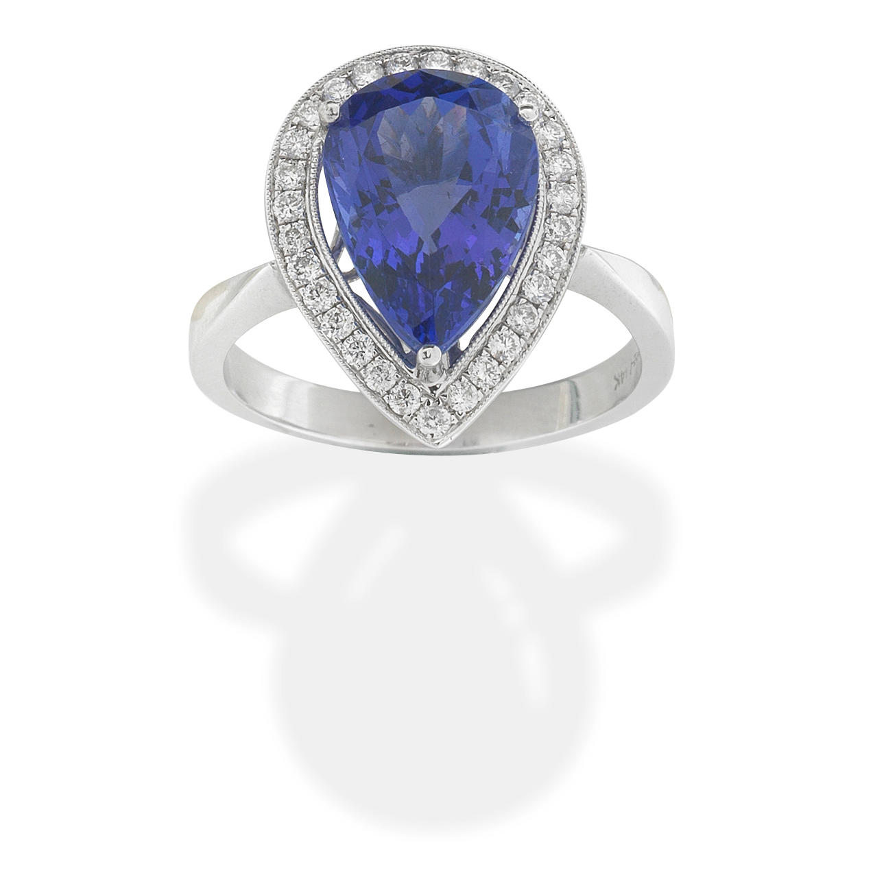 Appraisal: TANZANITE AND DIAMOND RING The pear-shaped tanzanite within a brilliant-cut