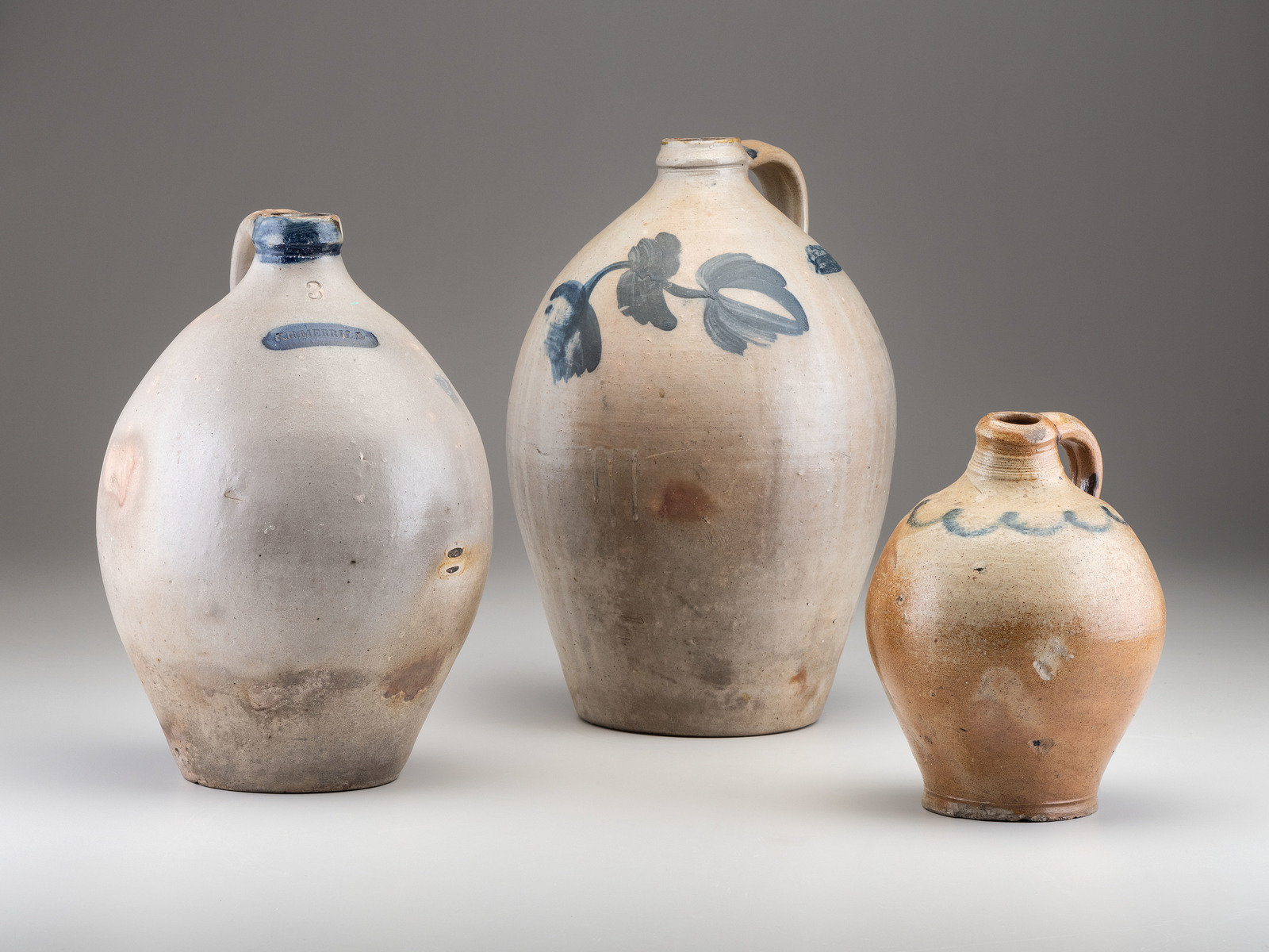 Appraisal: Three Cobalt Decorated Stoneware Jugs th Century comprising a Crolius