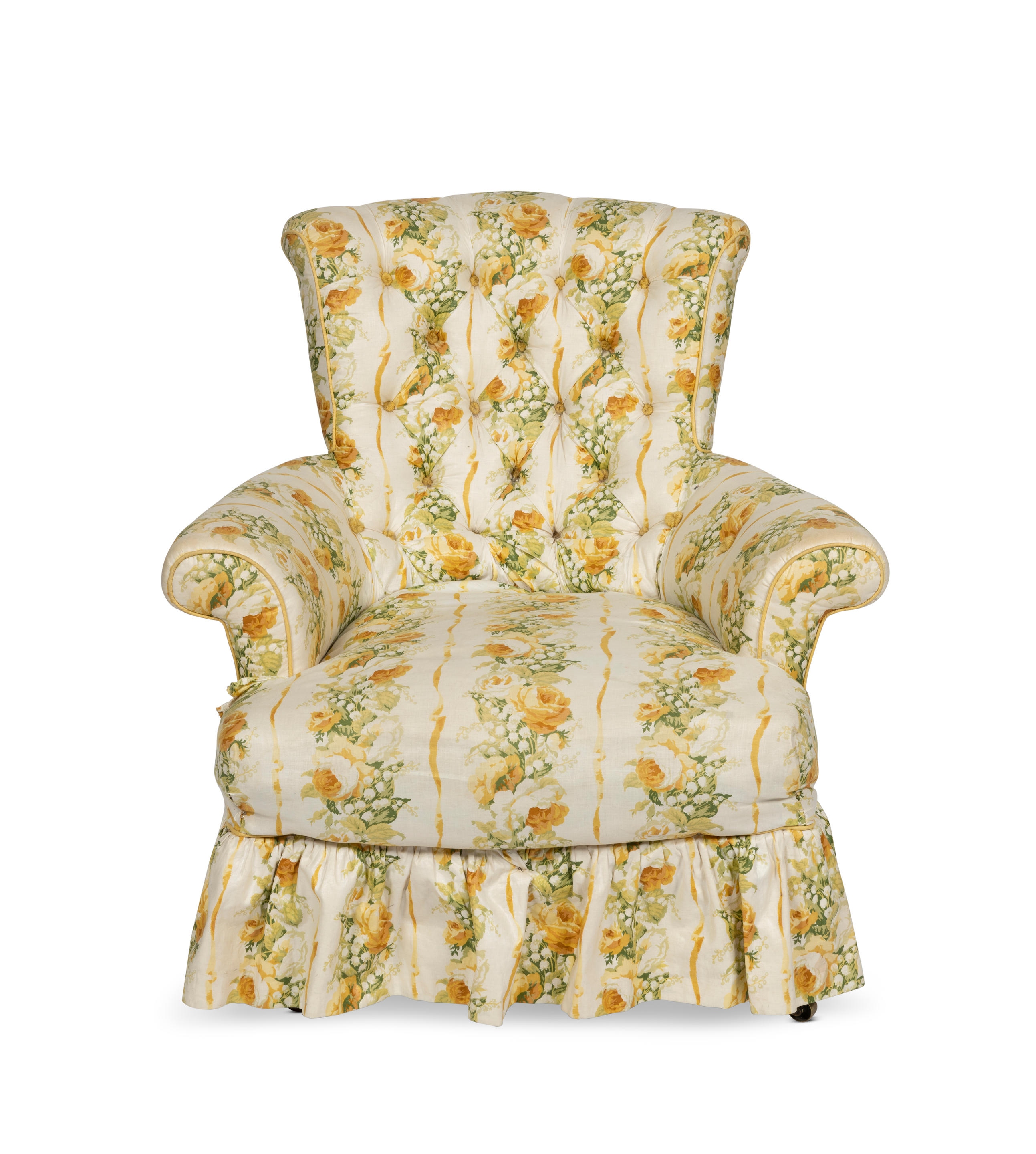 Appraisal: A VICTORIAN BUTTON-BACK ARMCHAIR Upholstered in a yellow floral chintz