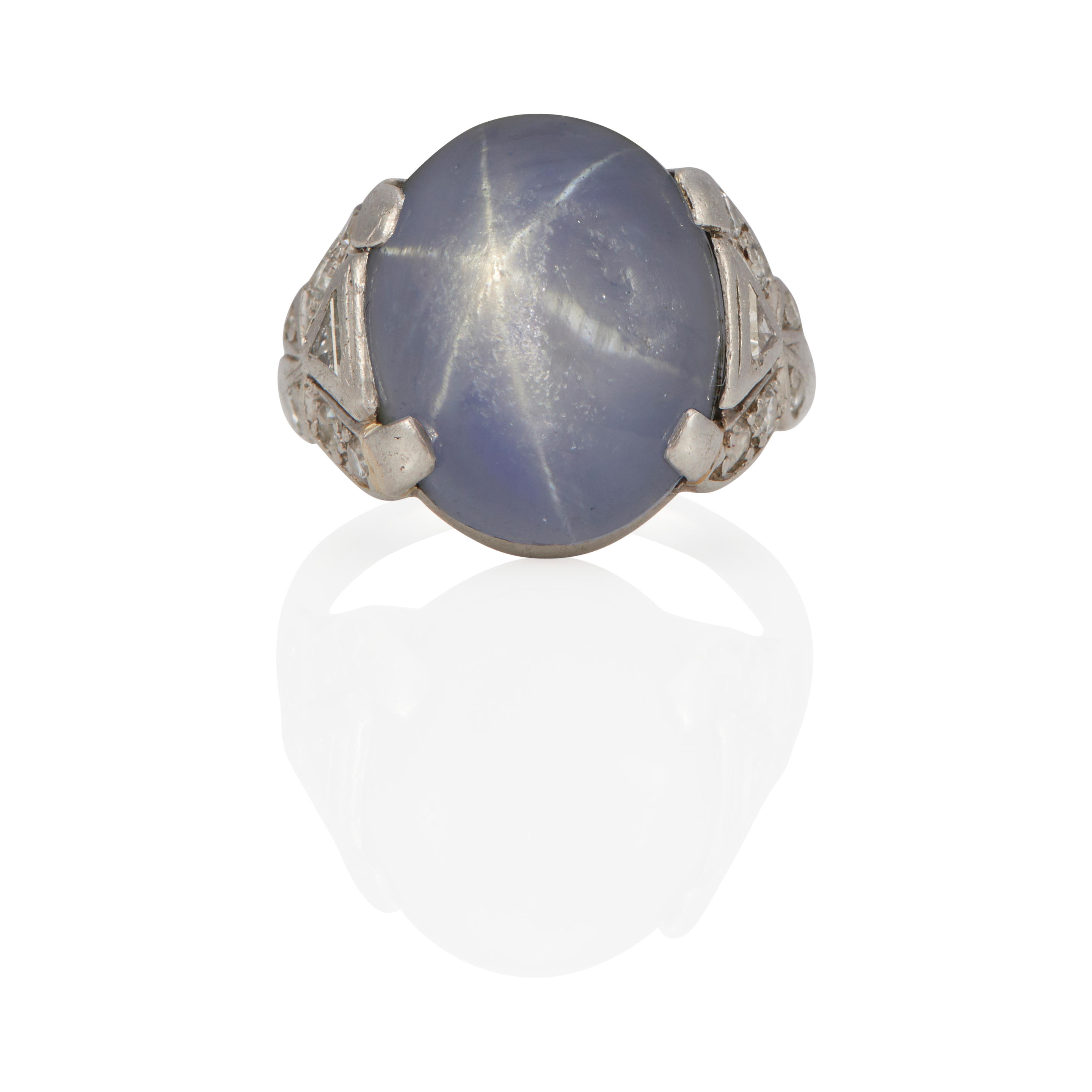 Appraisal: A PLATINUM STAR SAPPHIRE AND DIAMOND RING Platinum oval star