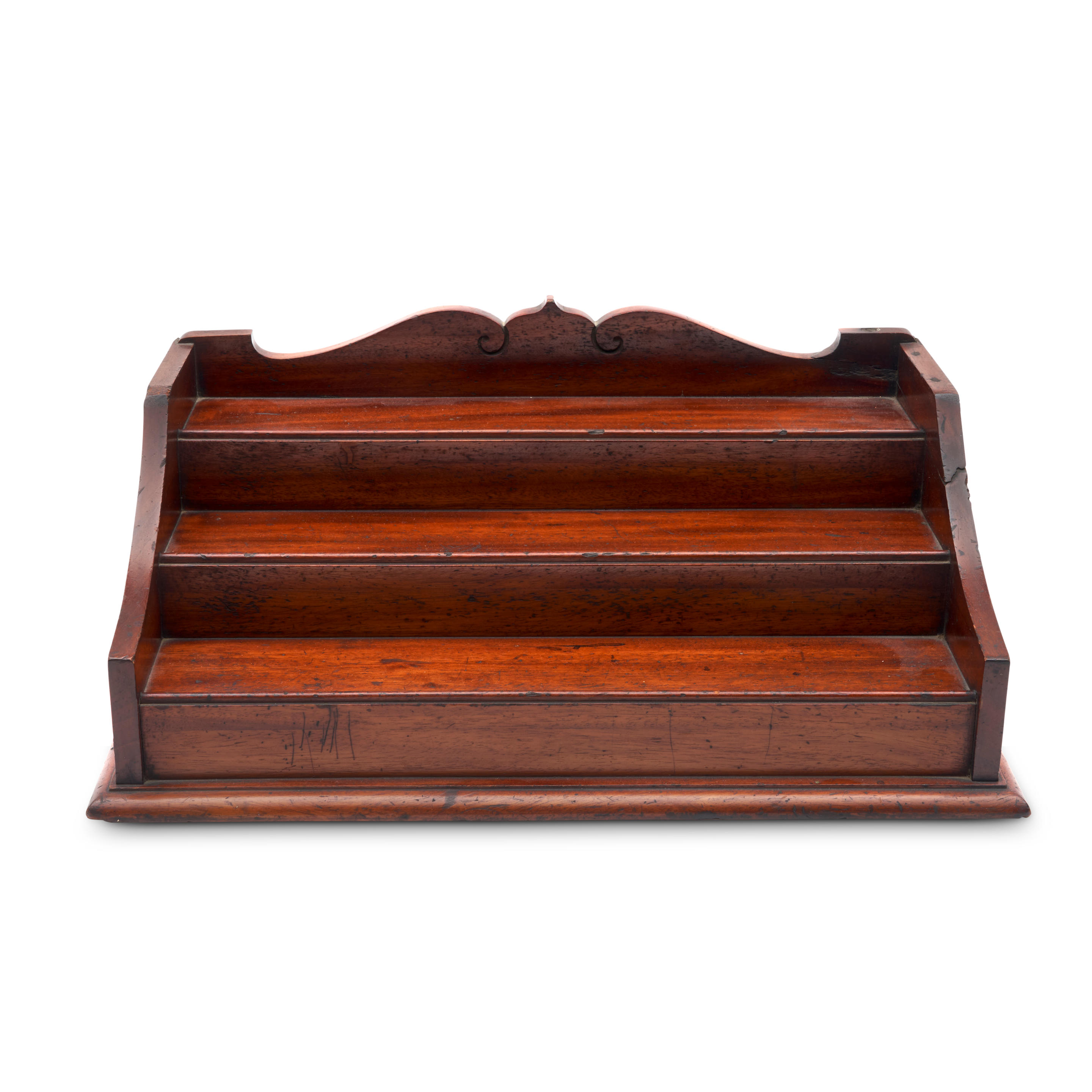 Appraisal: TIERED MAHOGANY DESKTOP SHELF America th century The ogee-arched backboard