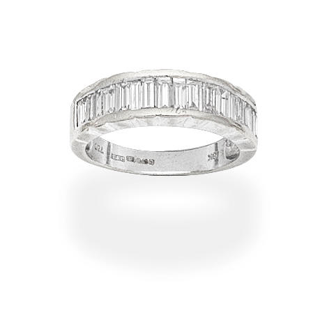 Appraisal: DIAMOND HALF ETERNITY RING Set with baguette-cut diamonds mounted in