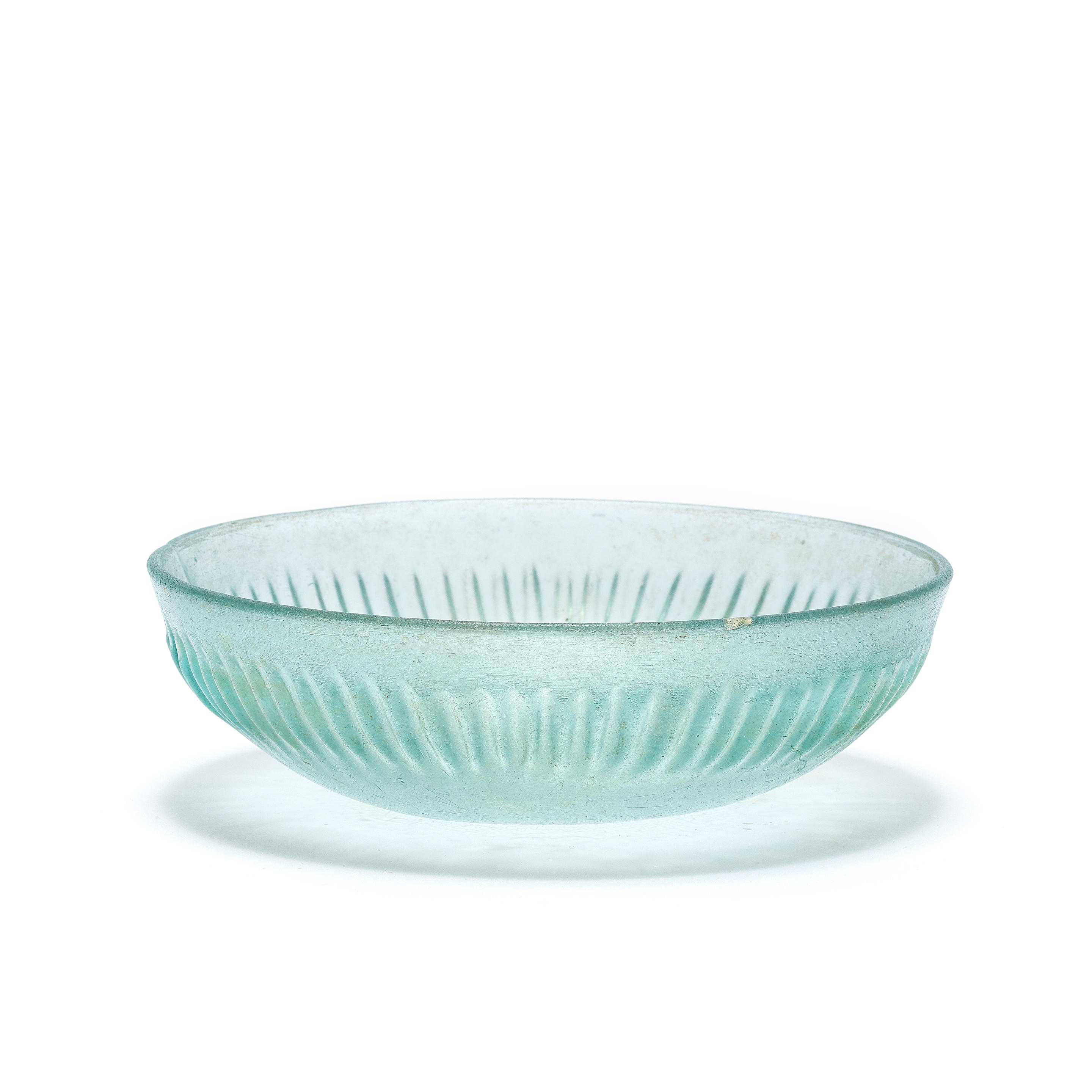 Appraisal: A ROMAN BLUE GLASS RIBBED BOWL A Roman blue glass