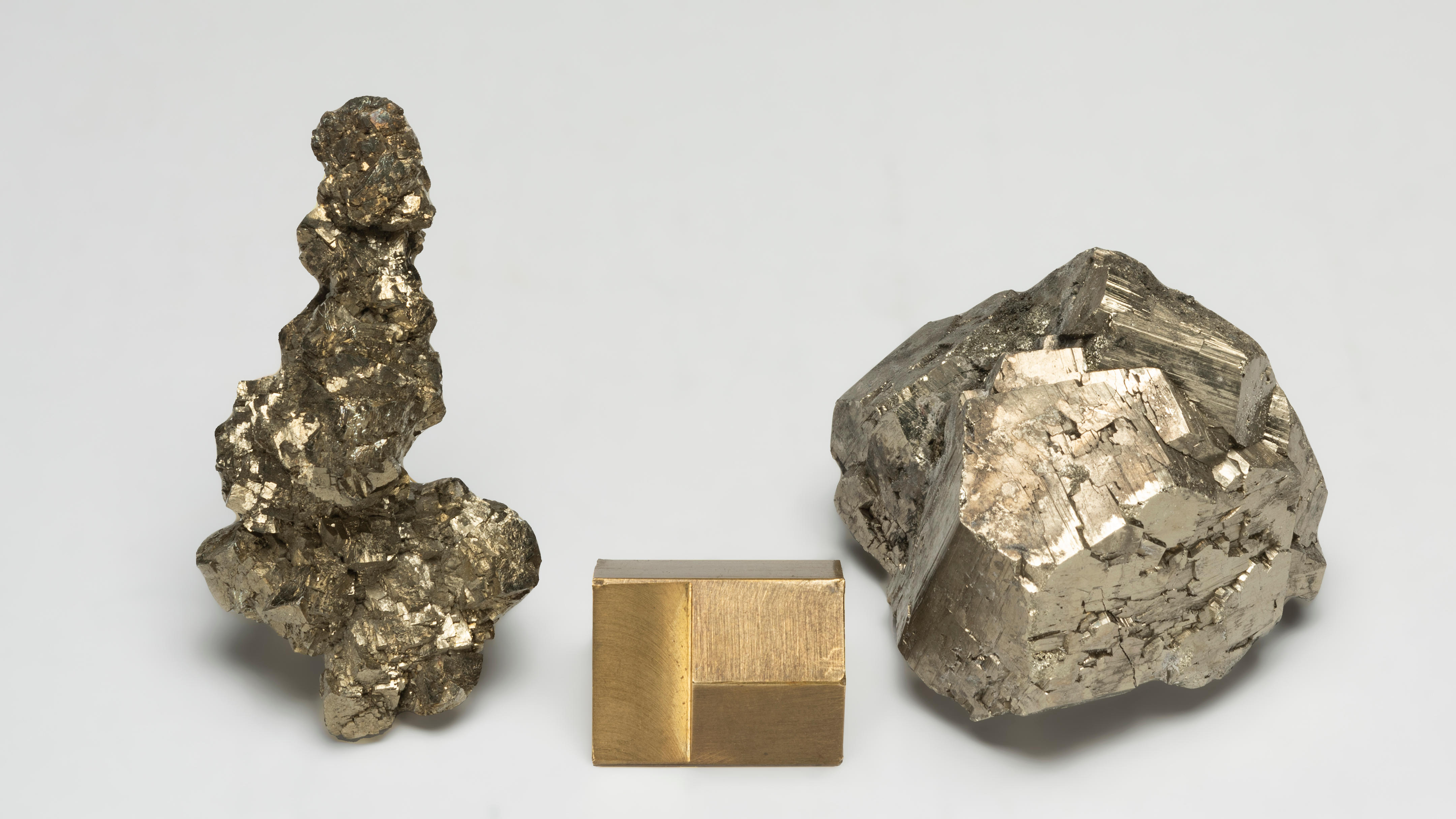 Appraisal: TWO PYRITES Elegant group of brassy interpenetrated crystals with good