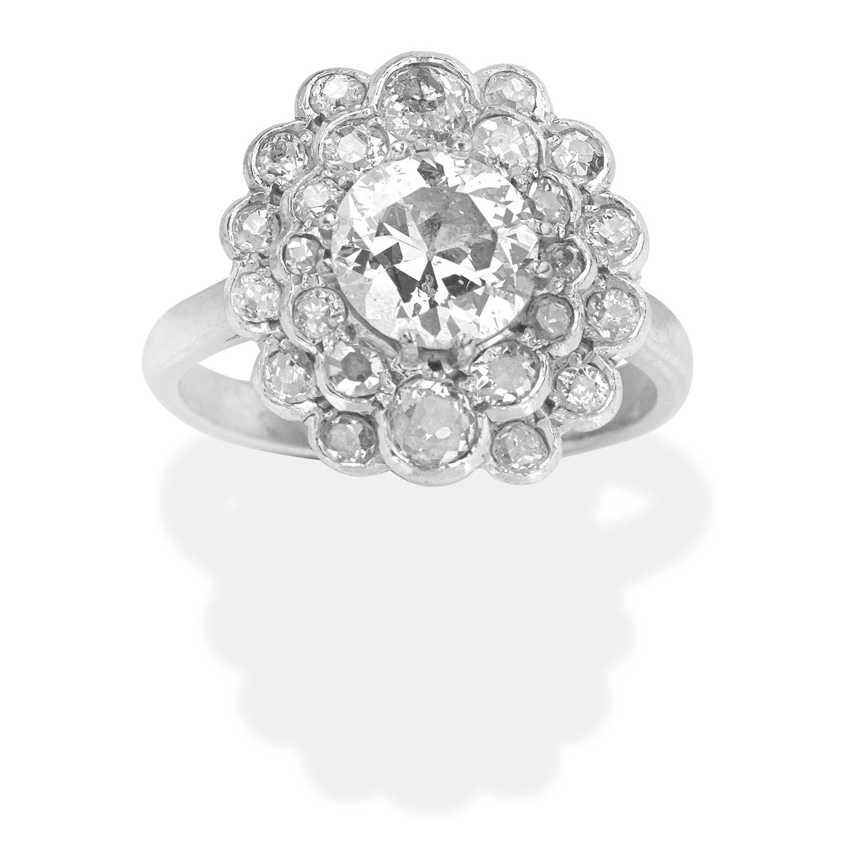 Appraisal: DIAMOND CLUSTER RING Central old brilliant-cut diamond within a surround